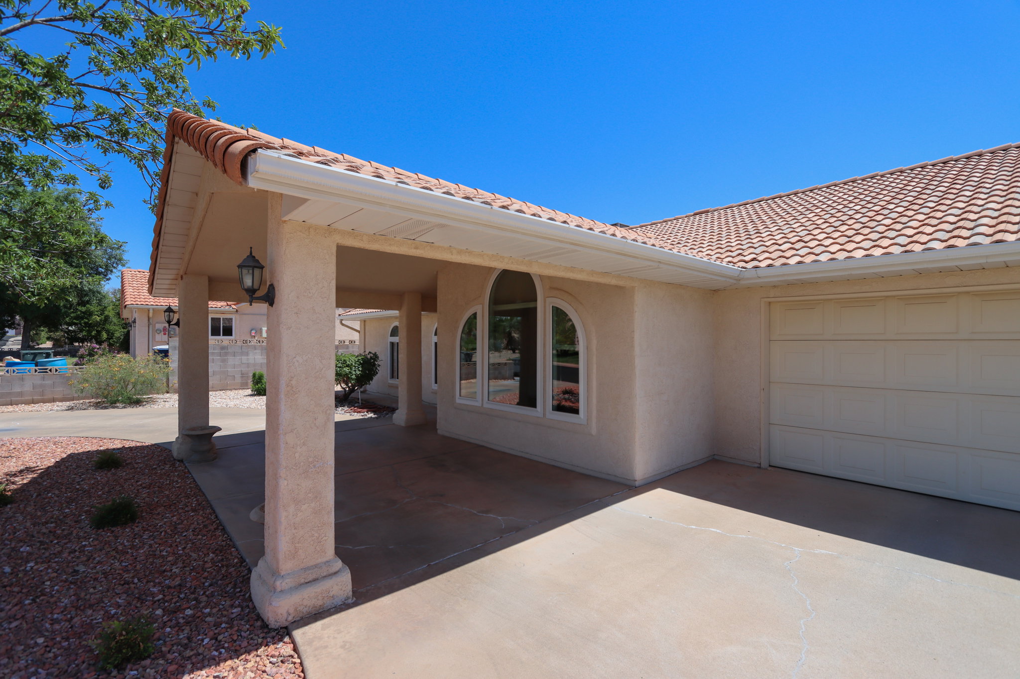 Stucco exterior with a terracotta tile roof