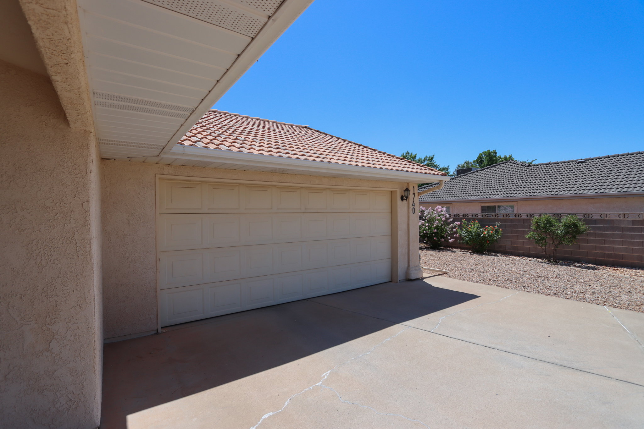 Attached two-car garage with a panel door