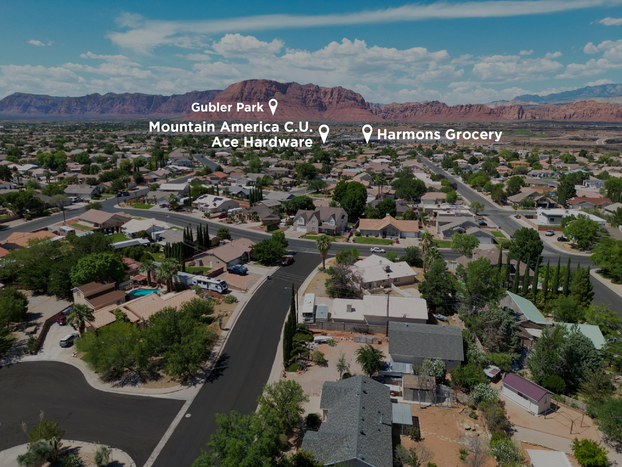 Aerial perspective showcasing a residential neighborhood with distant mountains