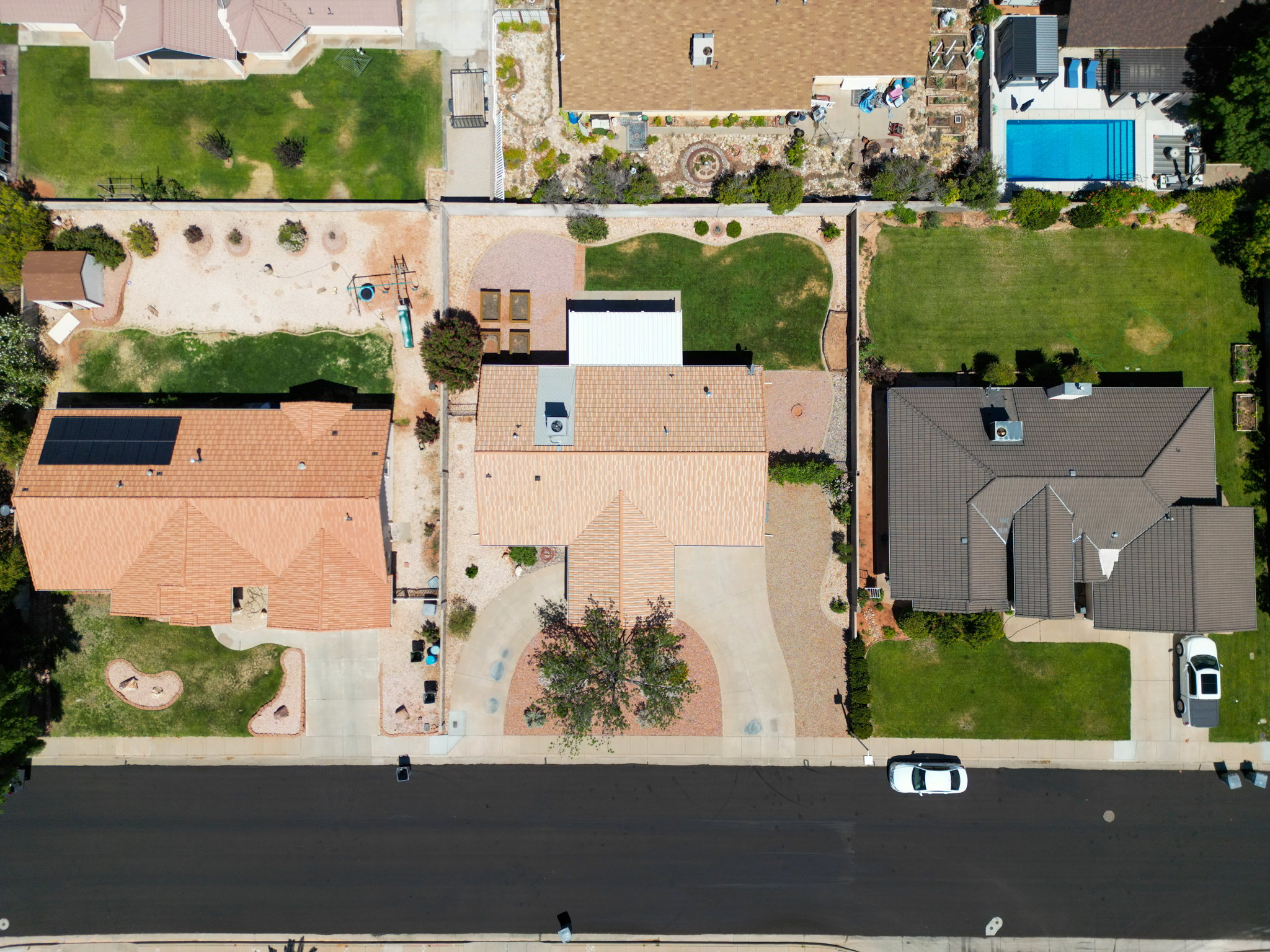 Aerial view of a residential property with an asphalt shingle roof