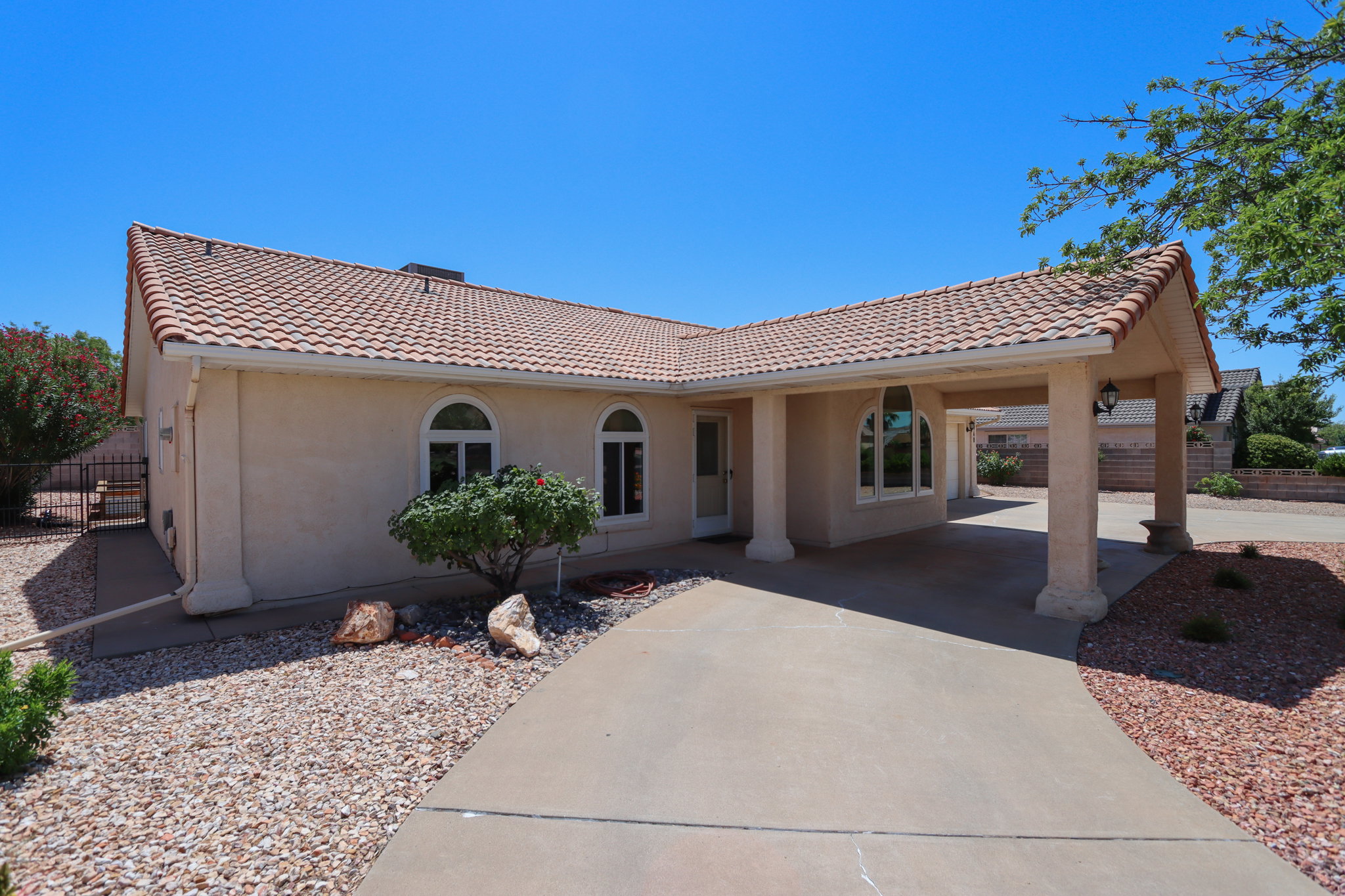 Stucco exterior with a terracotta tile roof