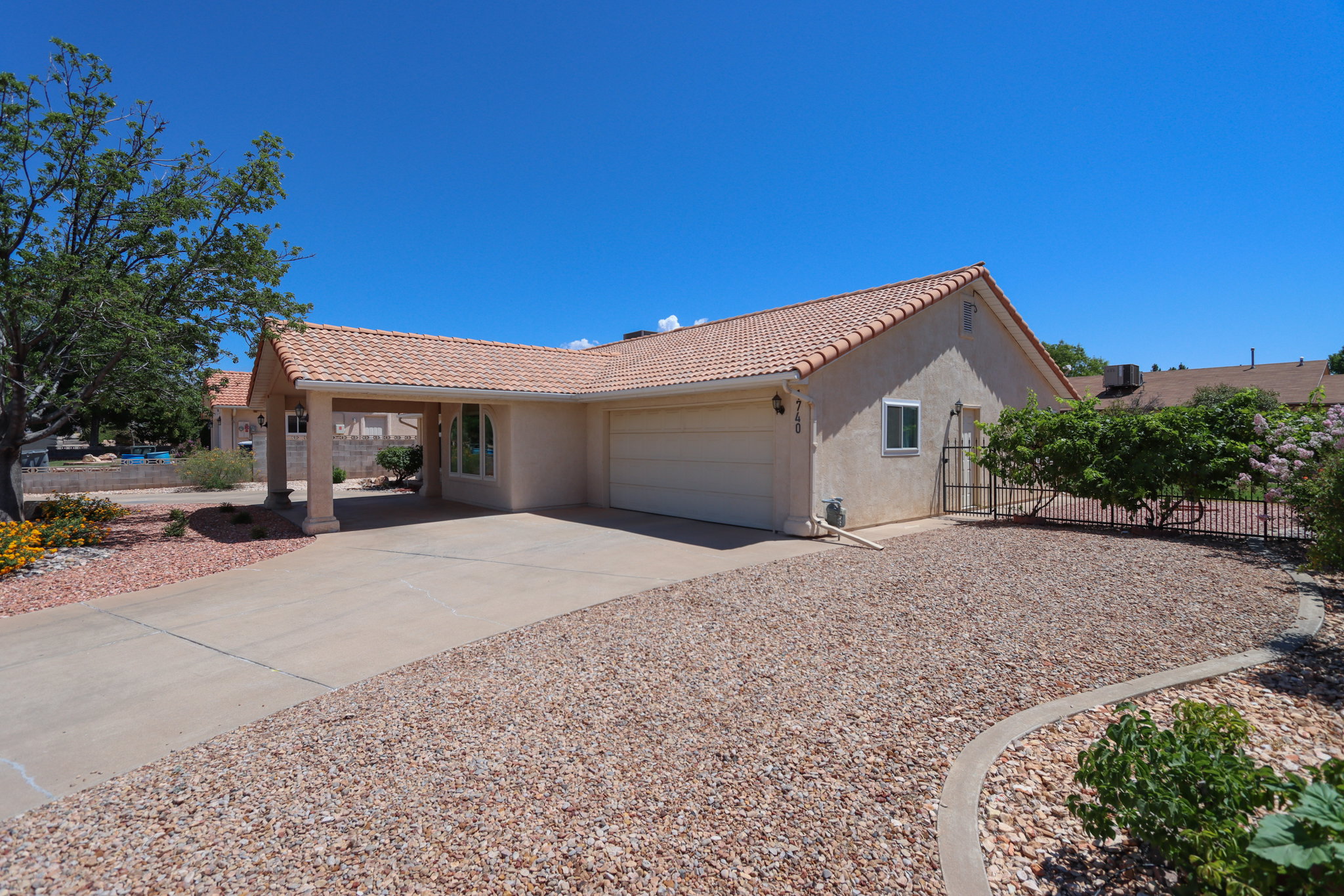 Southwestern-style stucco exterior with a terra cotta tile roof