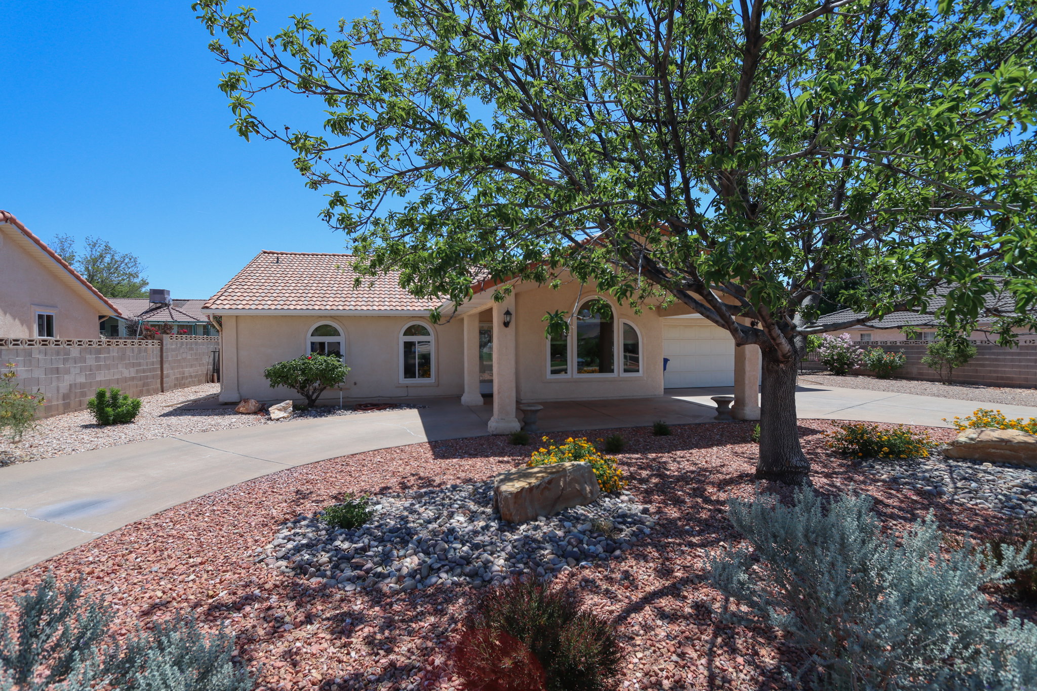 Stucco exterior with a terracotta tile roof