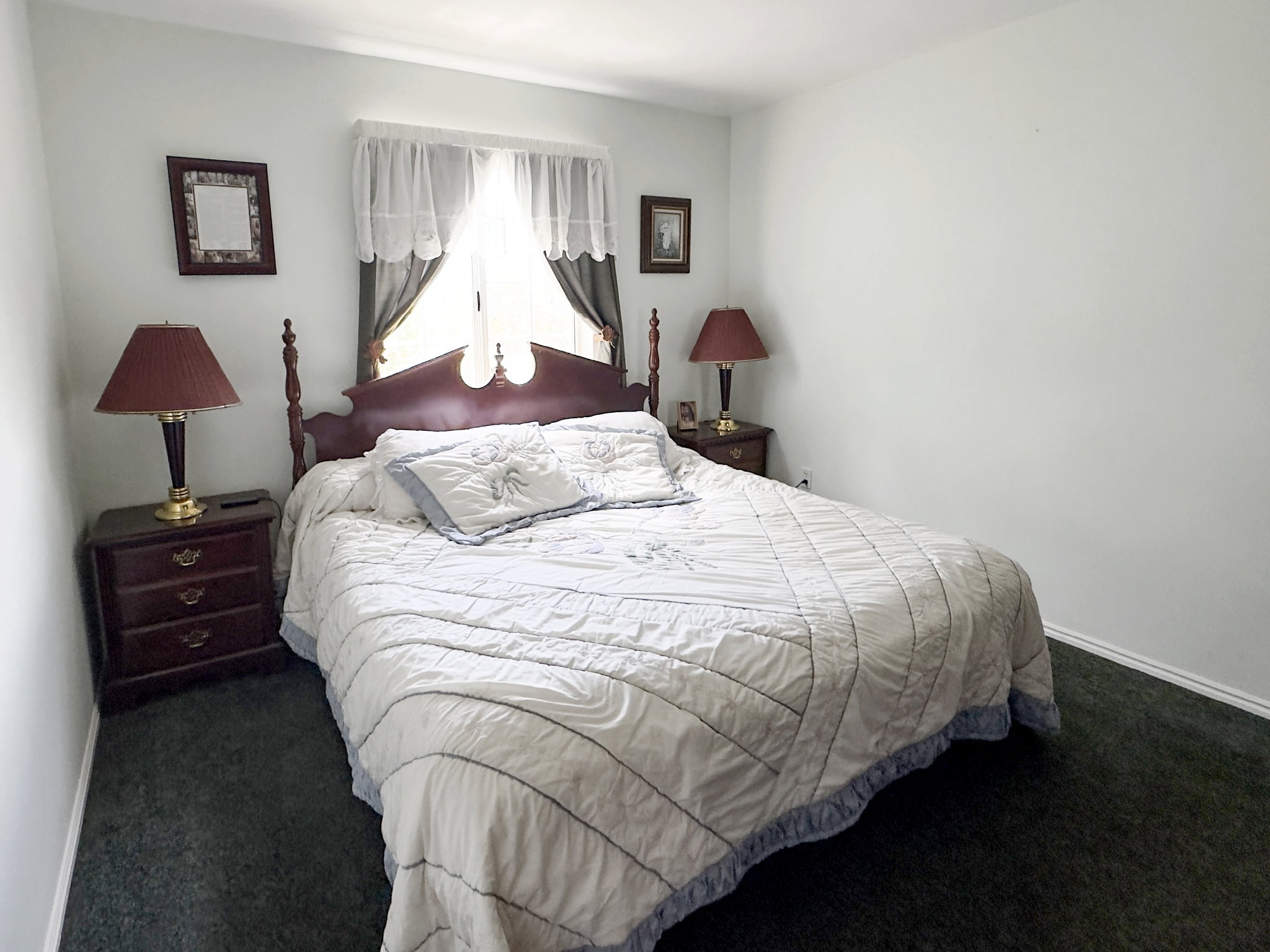 Bedroom featuring wall-to-wall carpeting and neutral wall tones