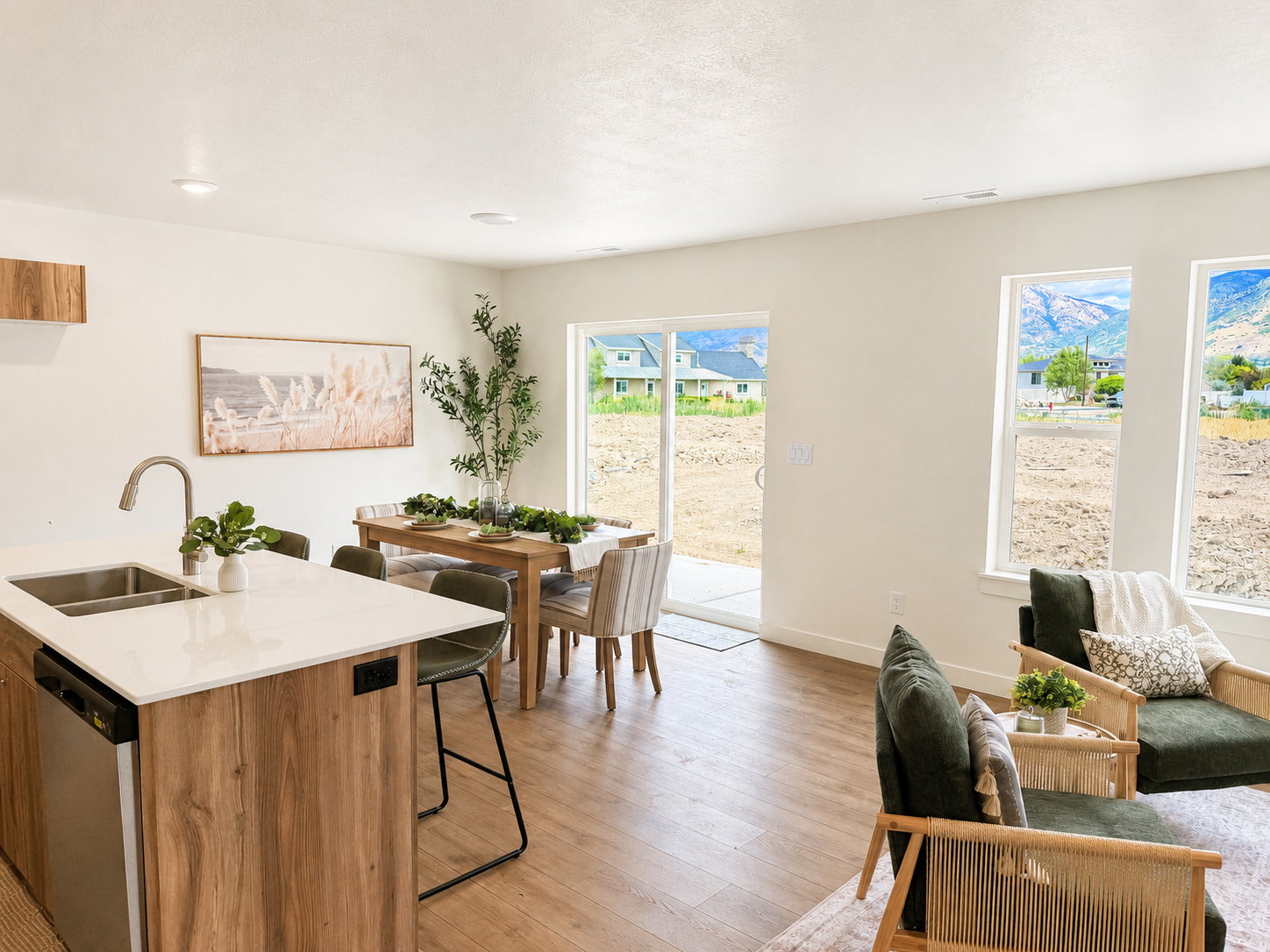 Open-concept living space featuring wood-finish flooring, white walls, and recessed lighting