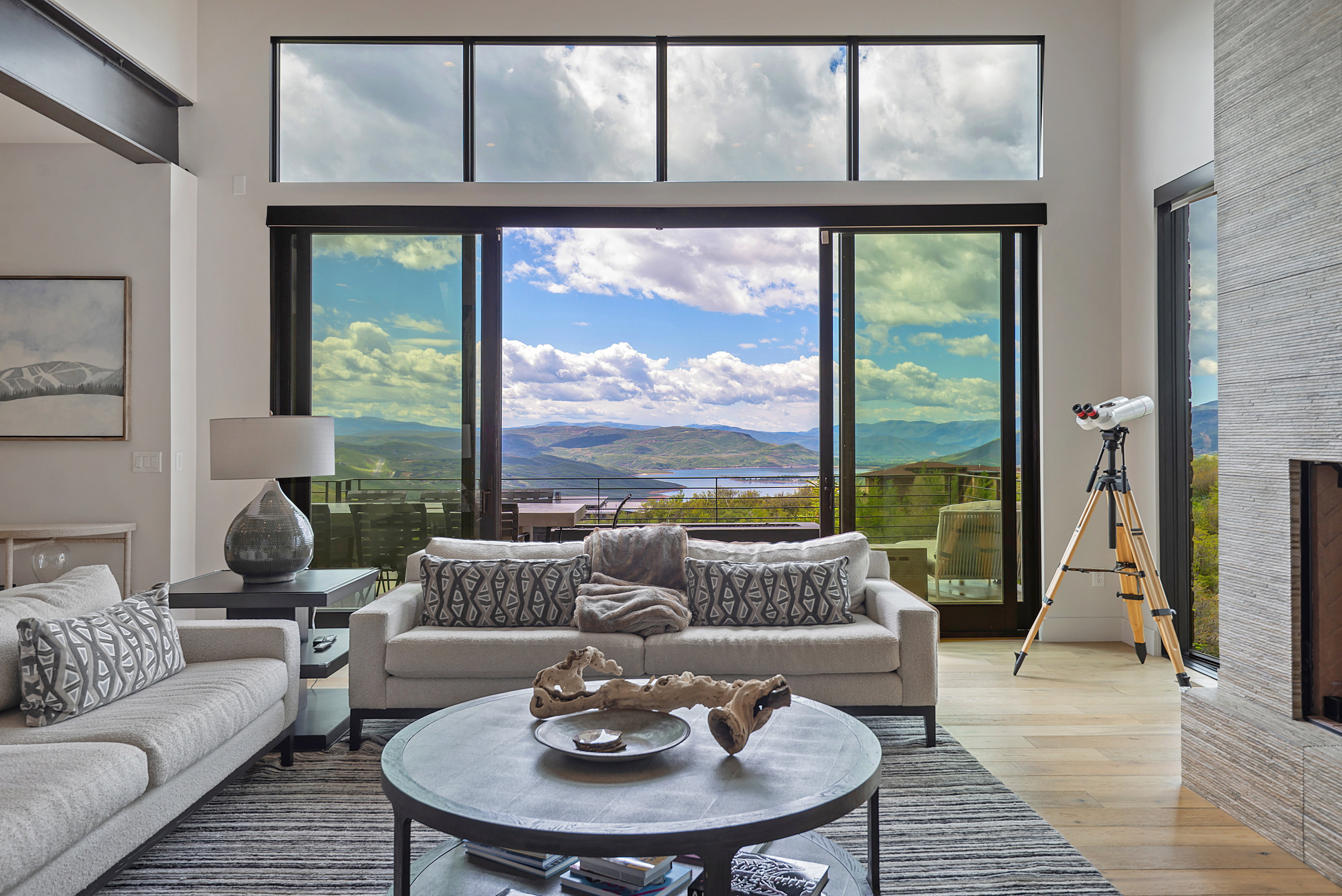 Bright living area featuring expansive sliding glass doors and transom windows