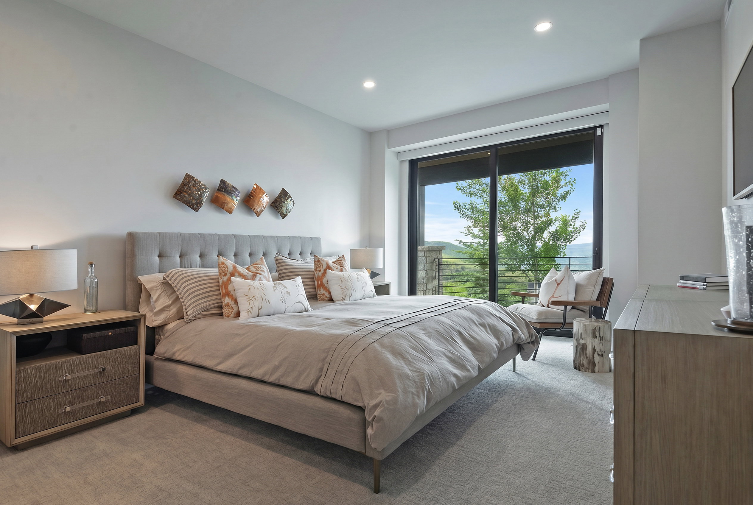 Spacious room with a large sliding glass door, recessed lighting, and light-toned carpeting