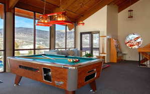 Expansive windows highlight the mountain backdrop