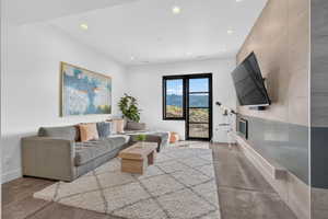 Open living area featuring a large window with mountain scenery