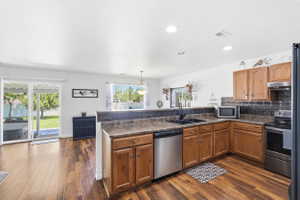 Kitchen featuring wood-finish flooring, recessed lighting, and sliding glass doors to the exterior