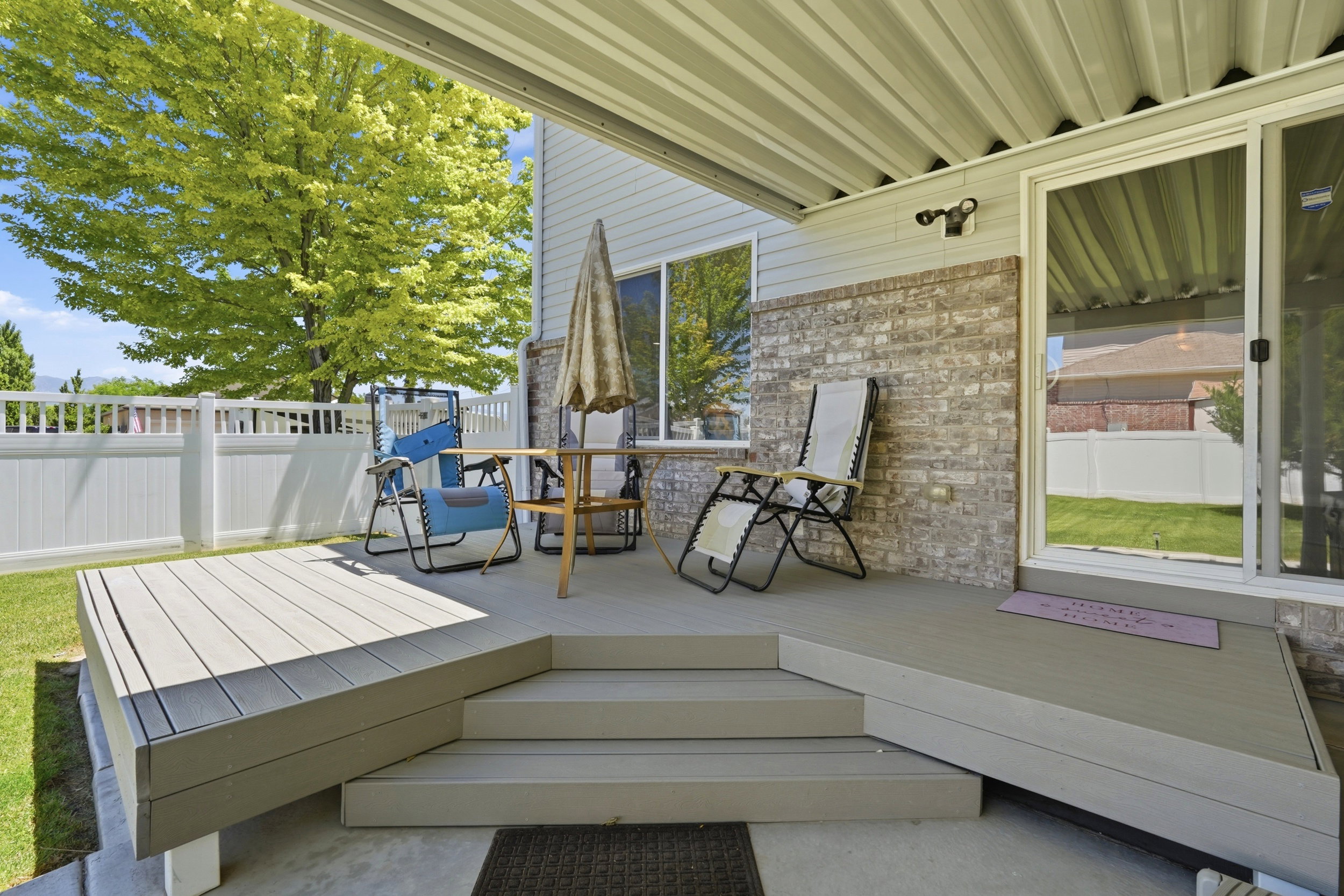 Covered outdoor patio with multi-level composite decking