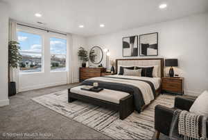 Spacious bedroom featuring plush carpeting, dual large windows, recessed lighting, and a neutral color palette