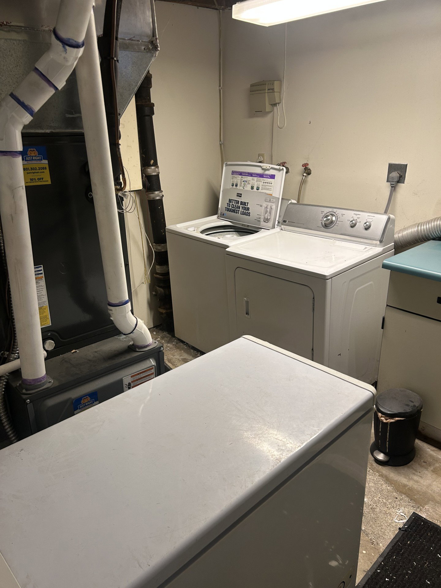 Dedicated utility area featuring a washer and dryer