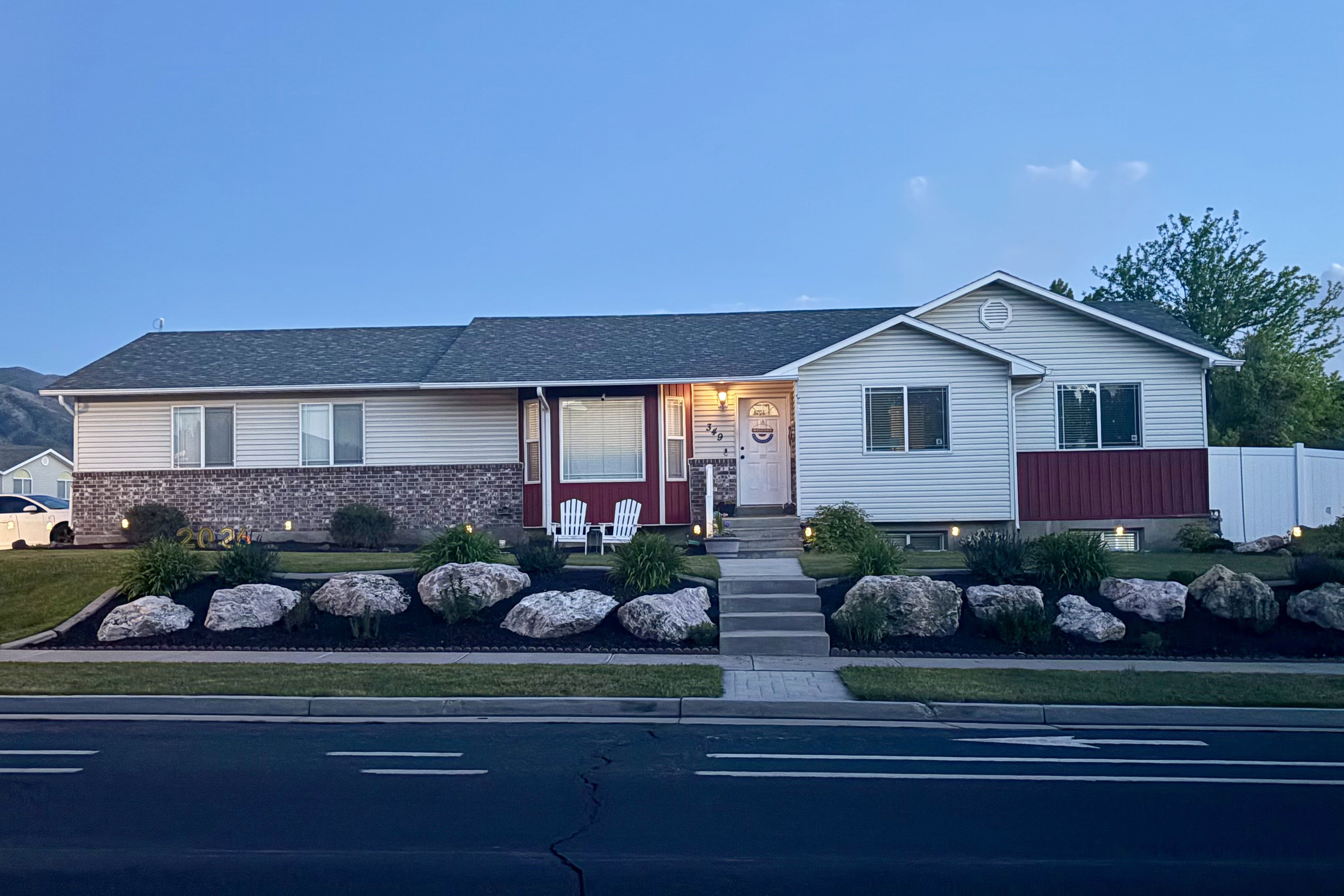 Split-level residence featuring a combination siding and brick veneer facade