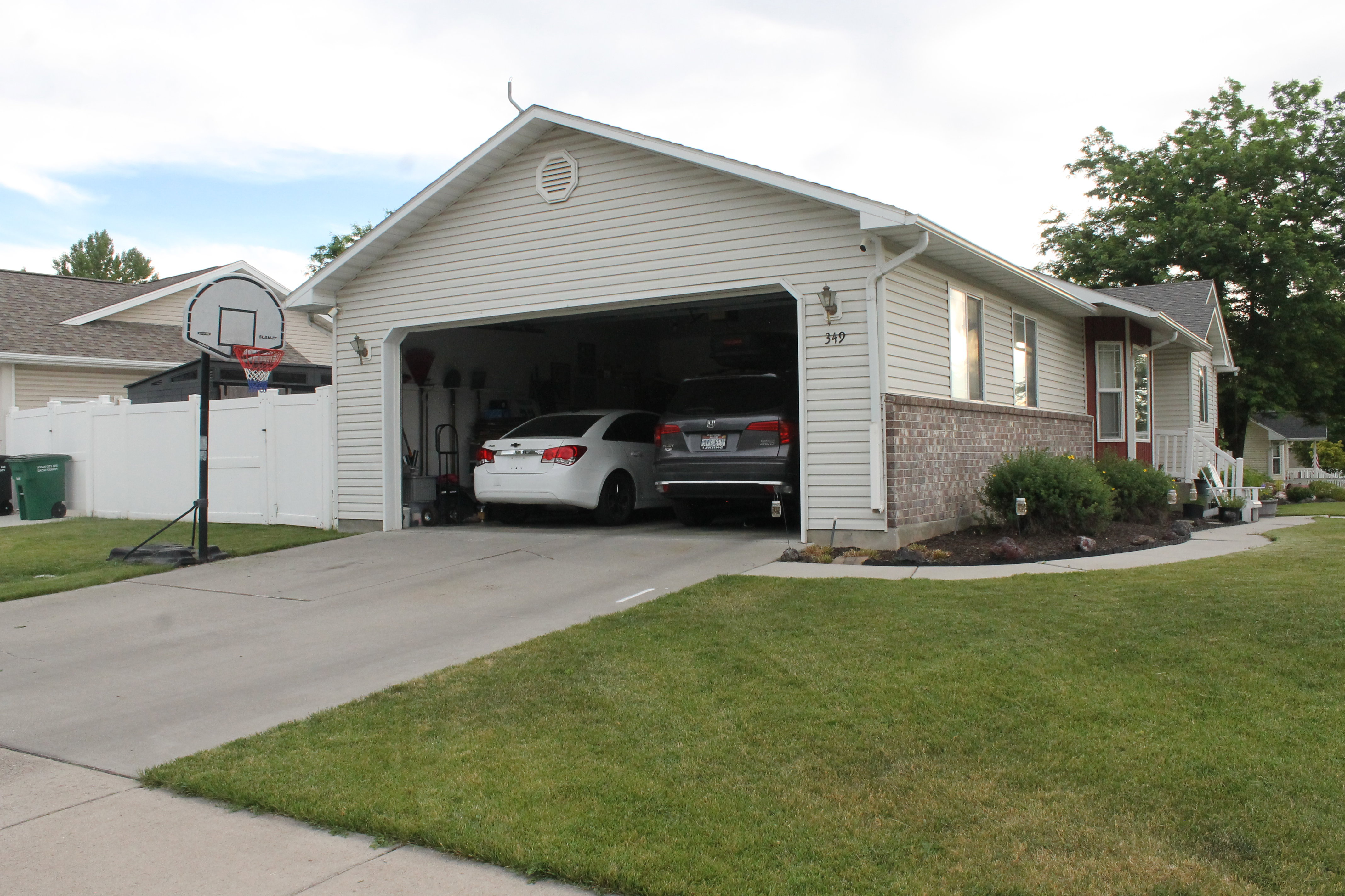 Two-car attached garage with white overhead door