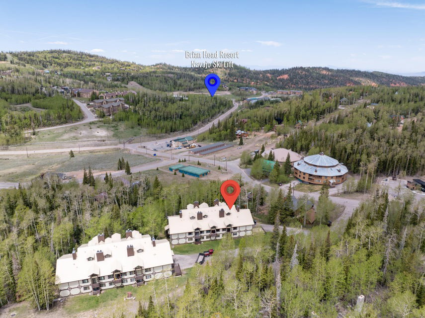Aerial perspective showcasing the property's setting within a mountainous landscape