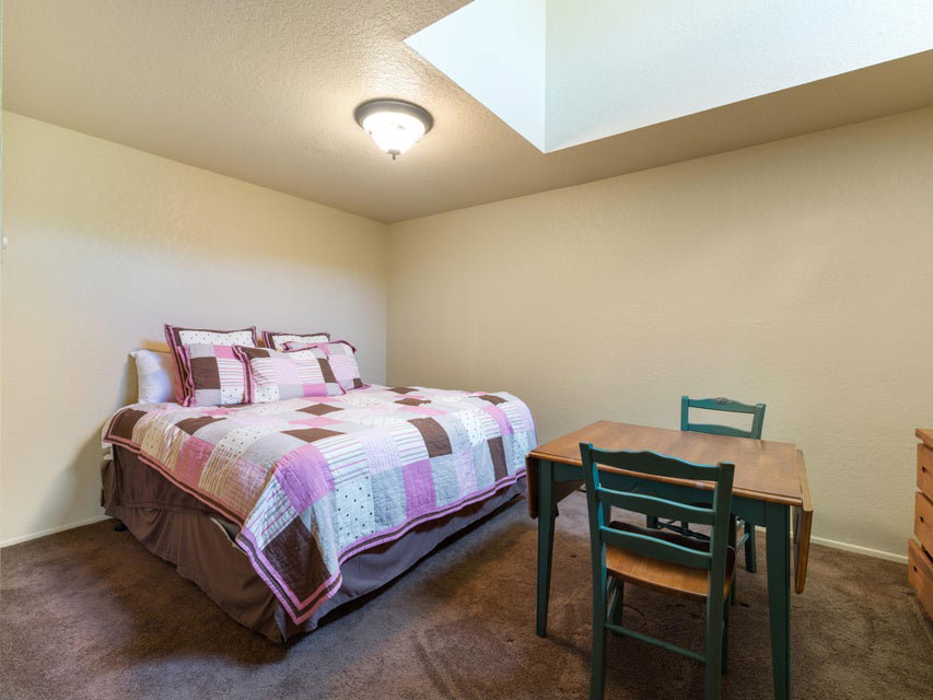 Recessed ceiling light fixture and a skylight provide illumination
