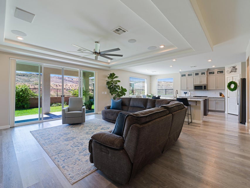 Open-concept living space with wood-finish flooring