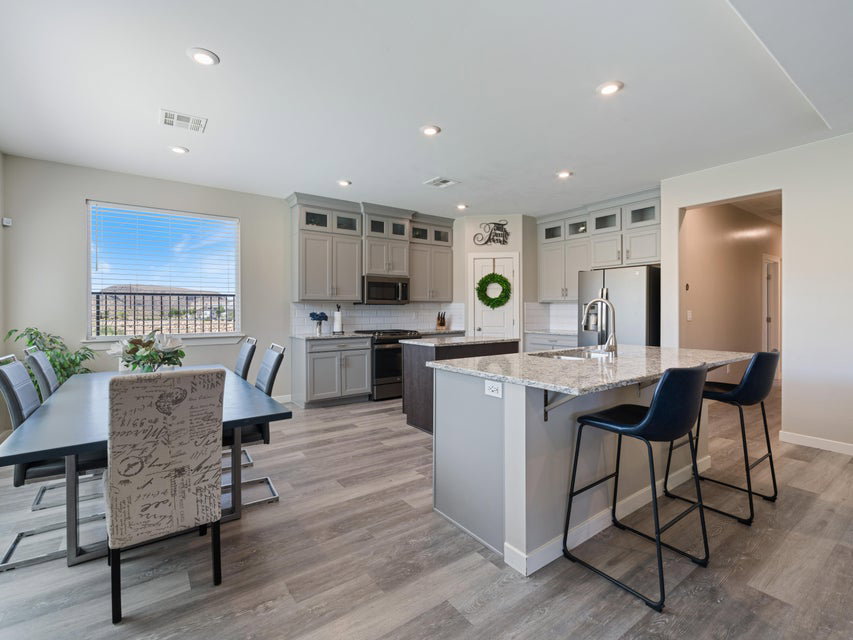 Open concept kitchen and dining area featuring light wood-finish flooring