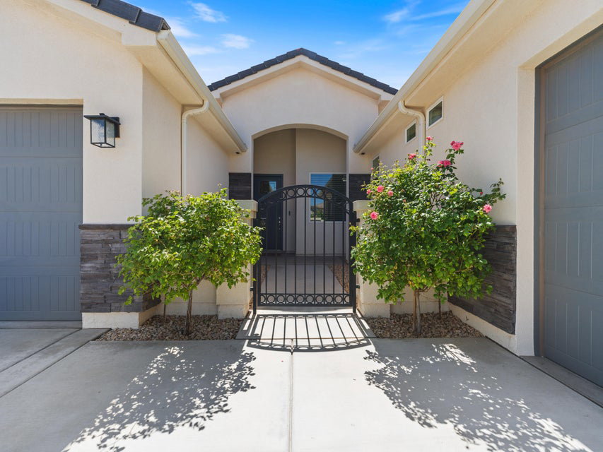 Exterior facade featuring stucco siding and stone veneer accents