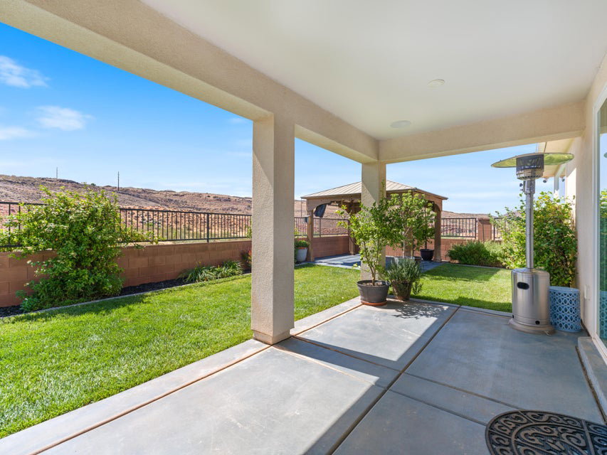Covered patio featuring a concrete slab and direct access to the backyard