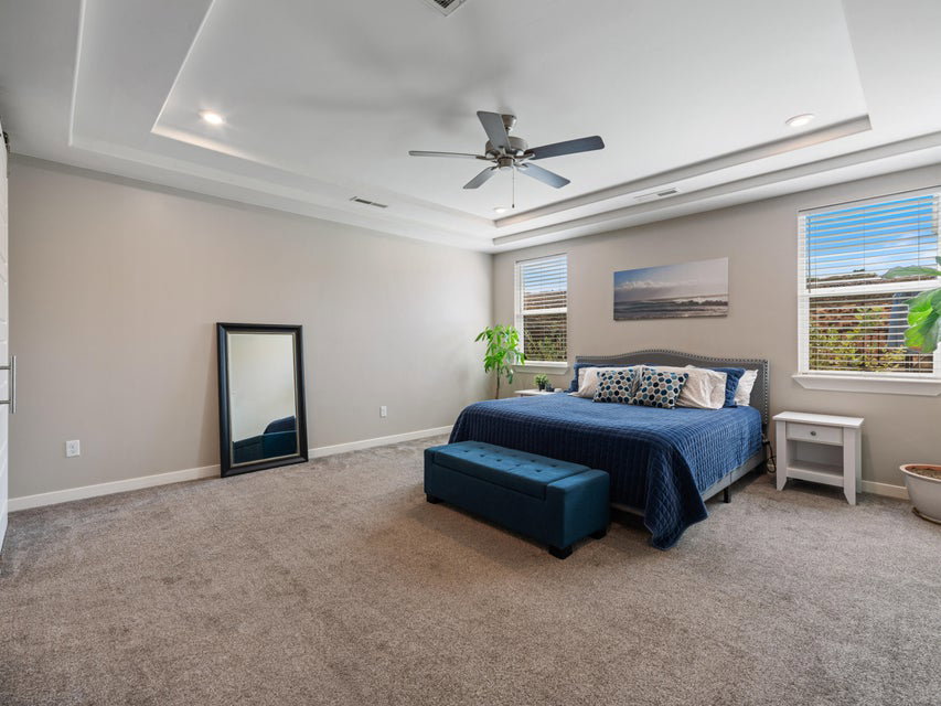 Recessed lighting illuminates a tray ceiling