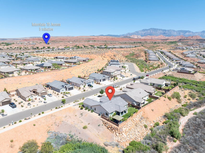 Aerial perspective showcasing a residential community with distant mountain ranges