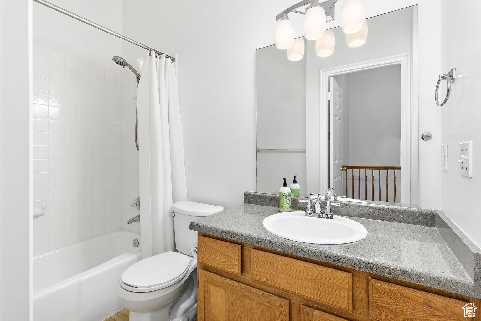 Full bathroom featuring a white tub-shower combination with subway tile surround