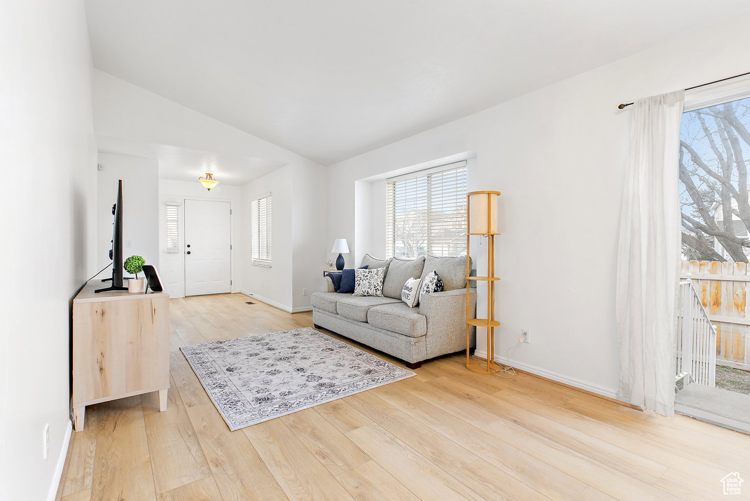 Open concept living area featuring light wood-finish flooring throughout