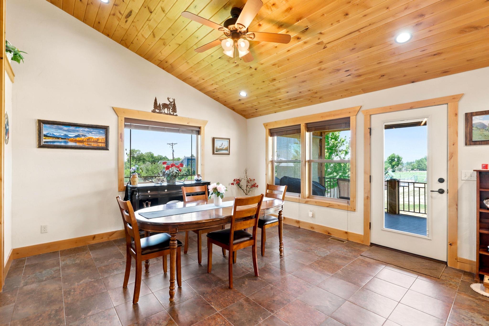 Vaulted wood-finish ceiling featuring recessed lighting and a ceiling fan