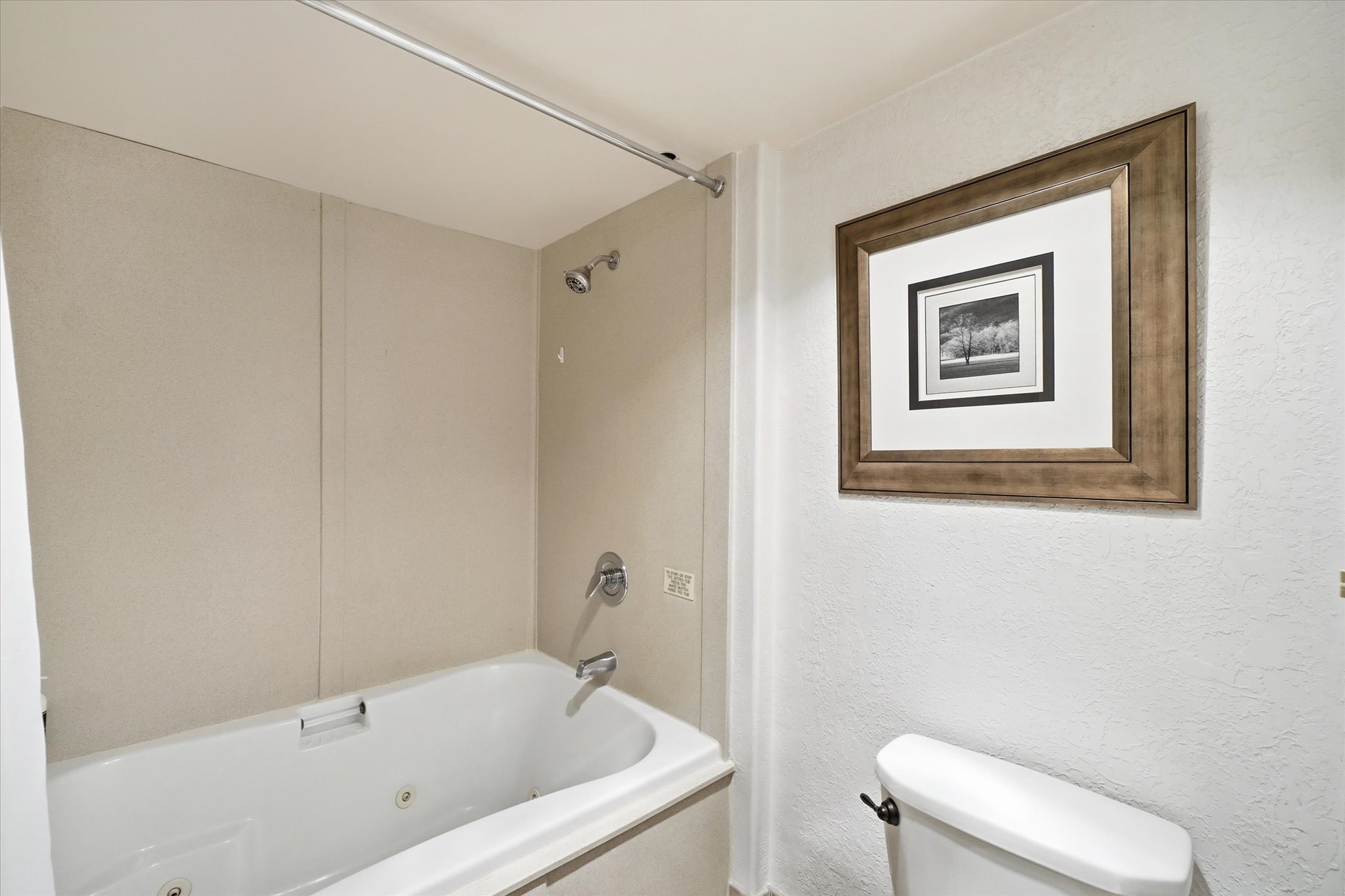 Built-in bathtub with integrated jets and chrome fixtures