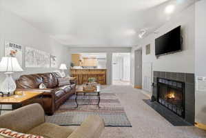 Open-concept living area with neutral wall tones and recessed lighting