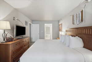 Spacious room featuring light gray walls and a flat white ceiling