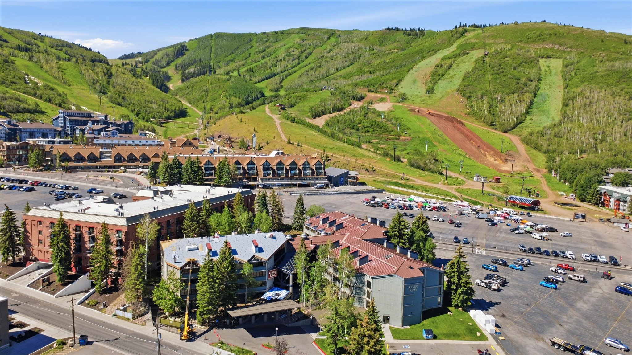 Mountainous terrain with green slopes and residential structures