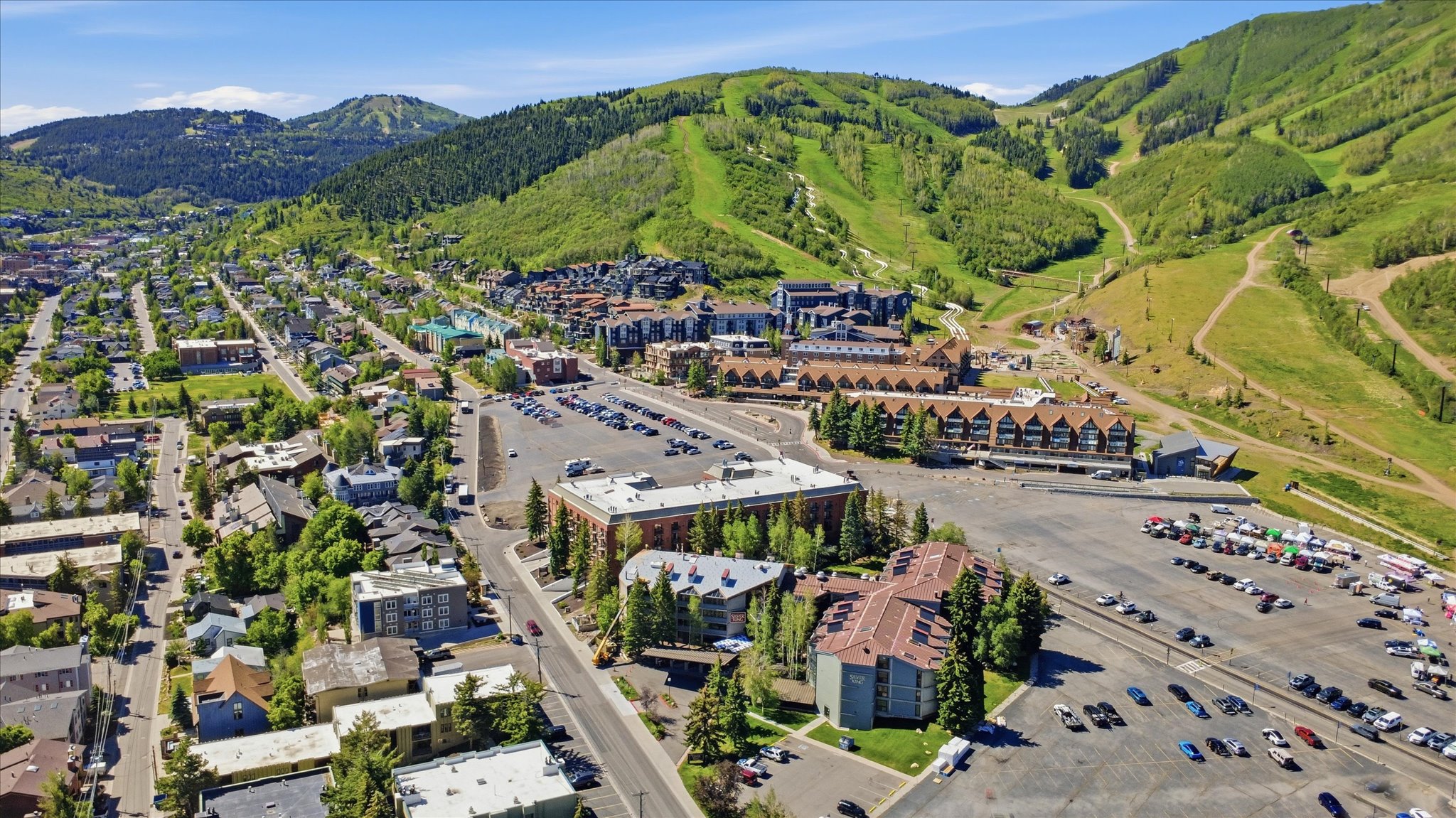 Aerial perspective of a mountain community featuring residential and commercial structures