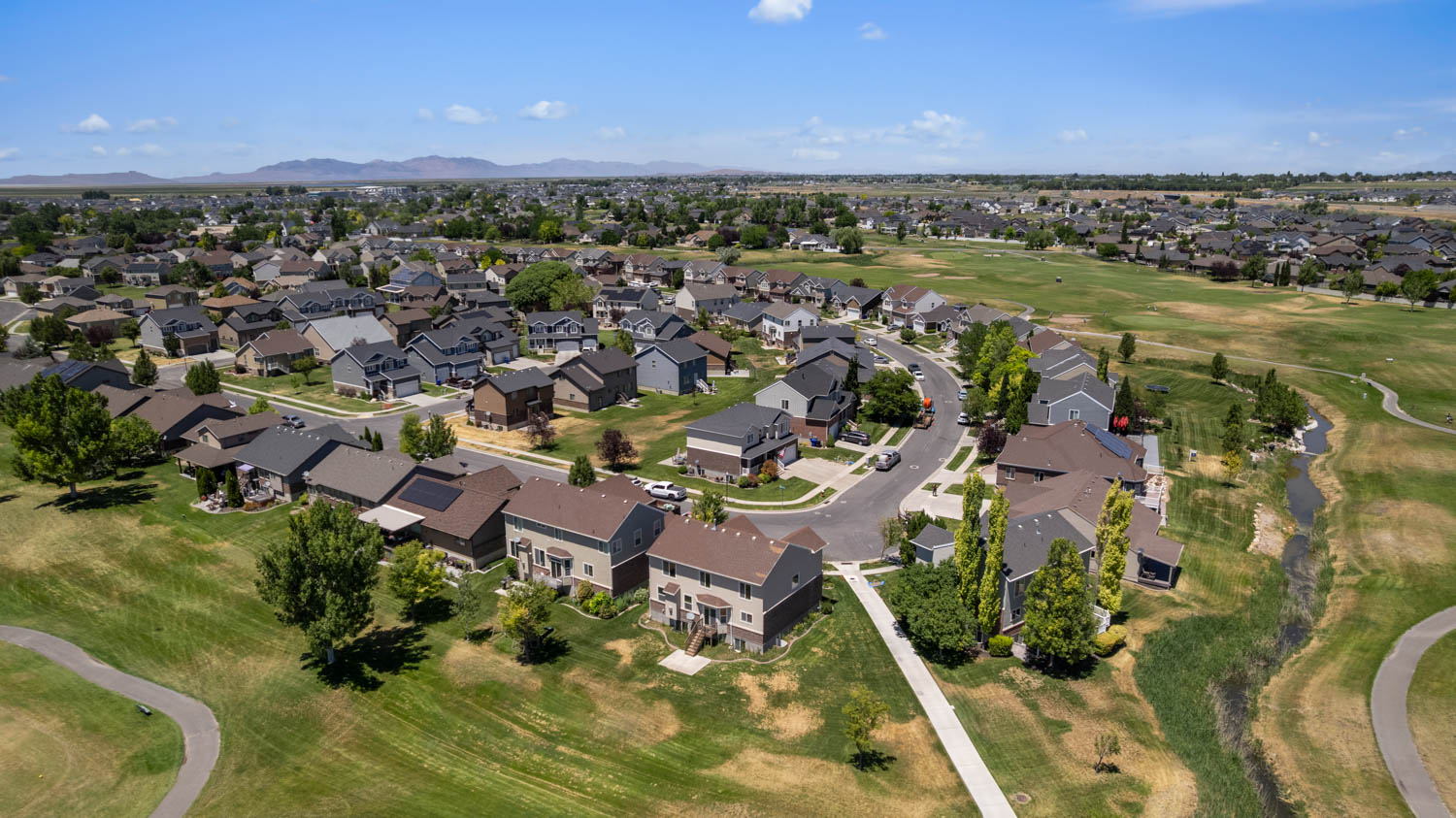 Residential neighborhood featuring a curvilinear street layout and a variety of architectural styles