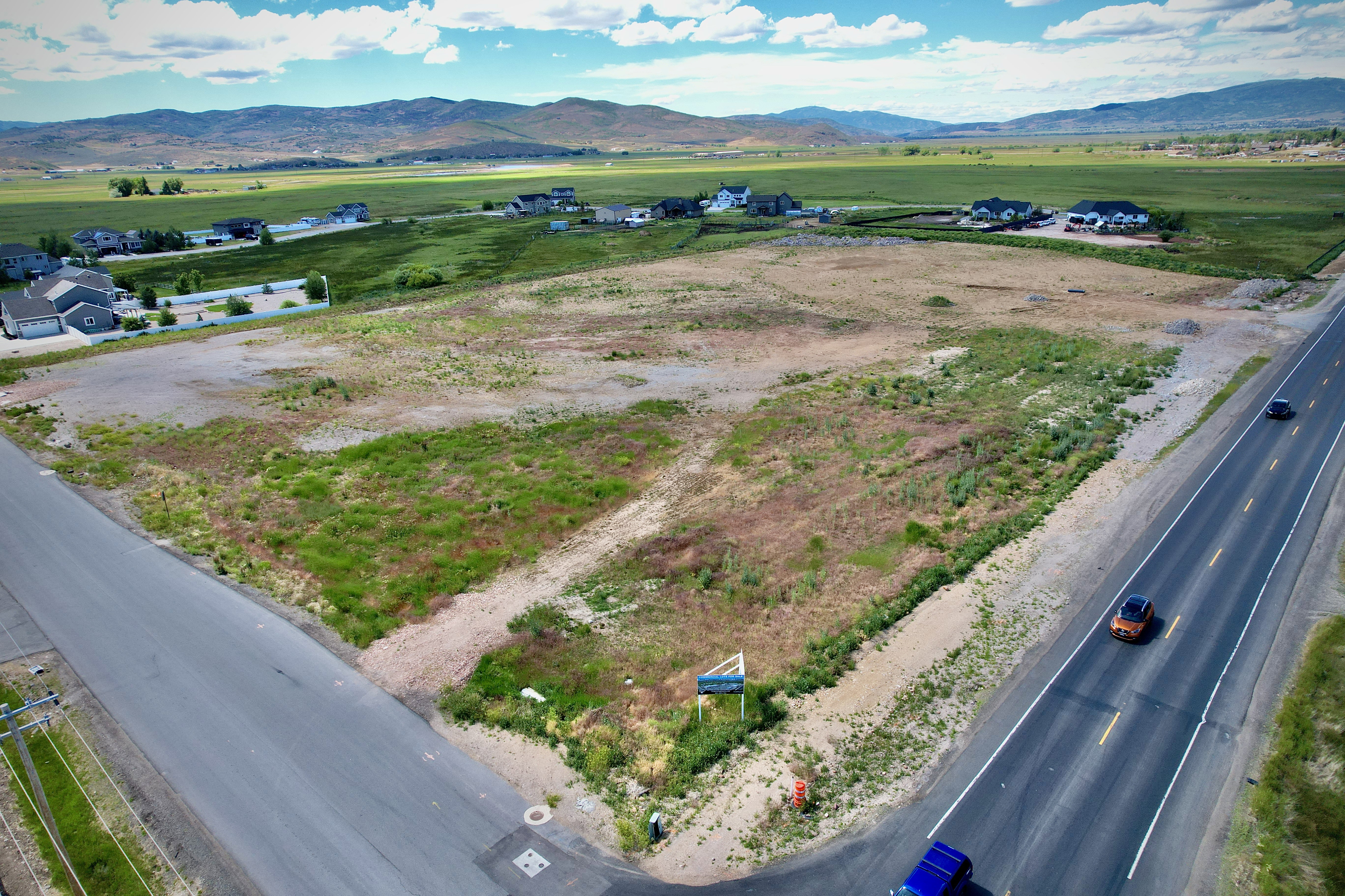 Expansive undeveloped land parcel featuring existing road frontage