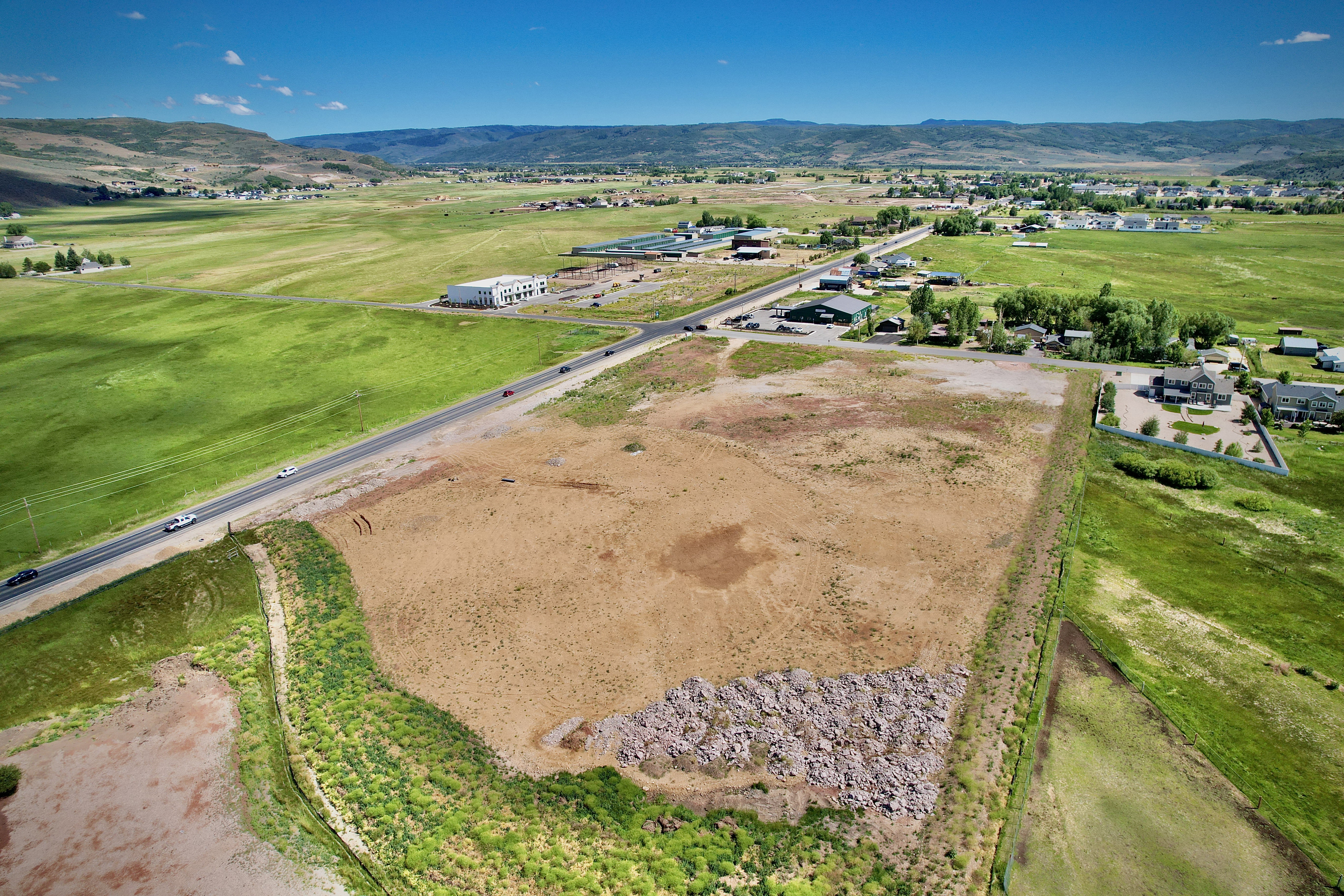 Expansive parcel featuring a mix of cleared land and natural ground cover