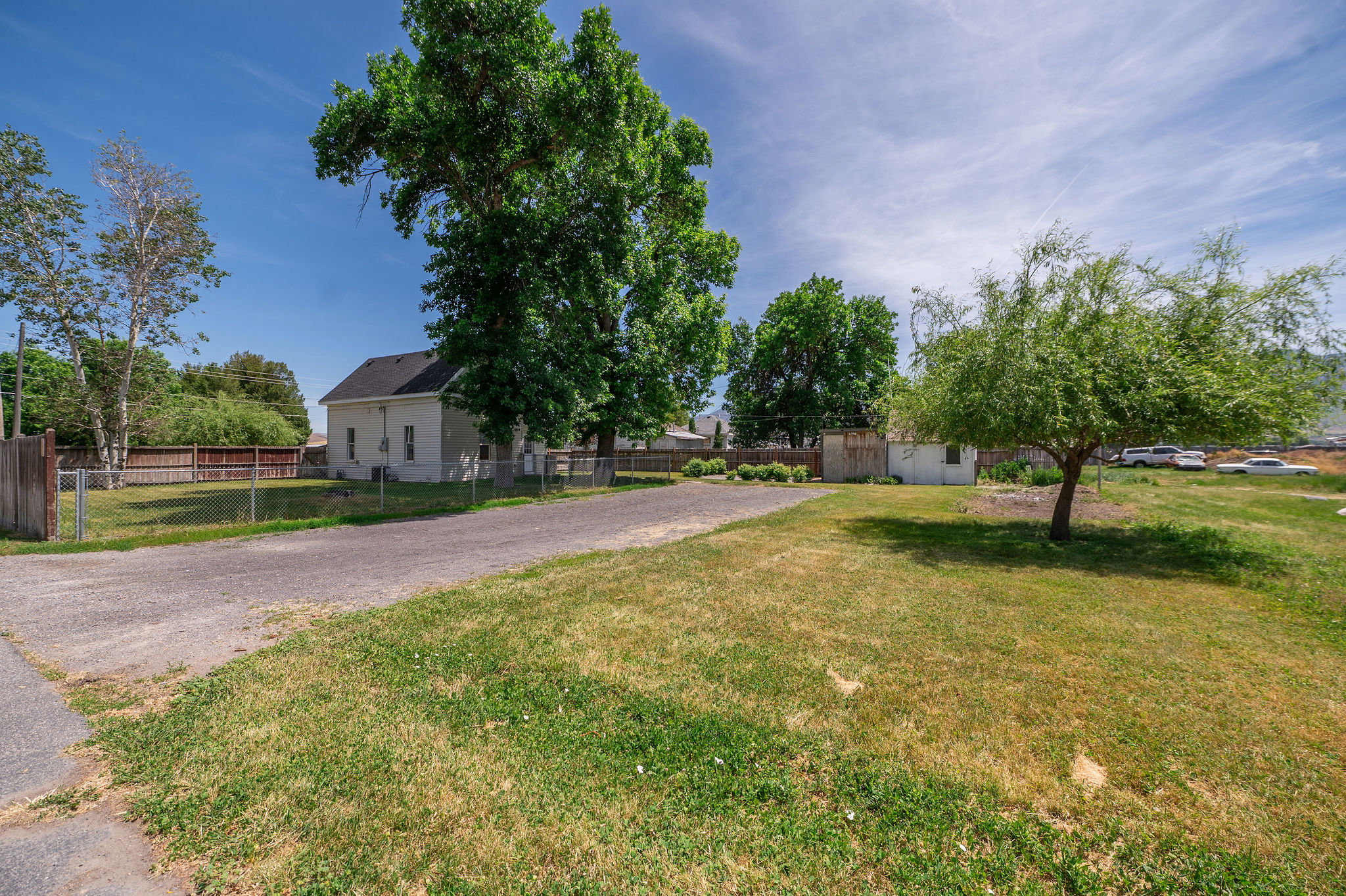 Expansive gravel driveway providing extensive parking
