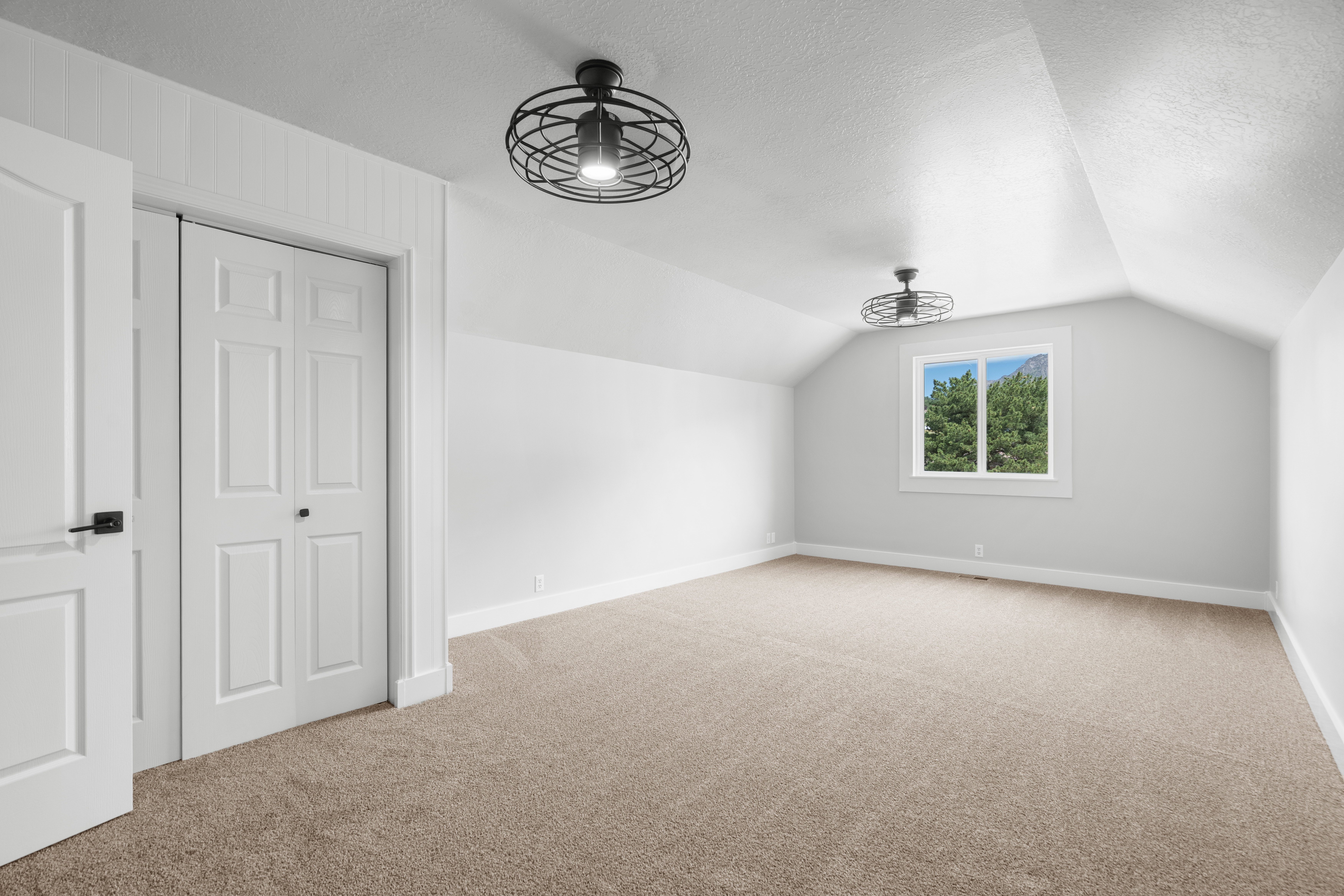 Bright and spacious flex bonus room featuring vaulted ceilings and neutral carpeting, offering flexible space ideal for a family room, game room, media room, or additional bedroom