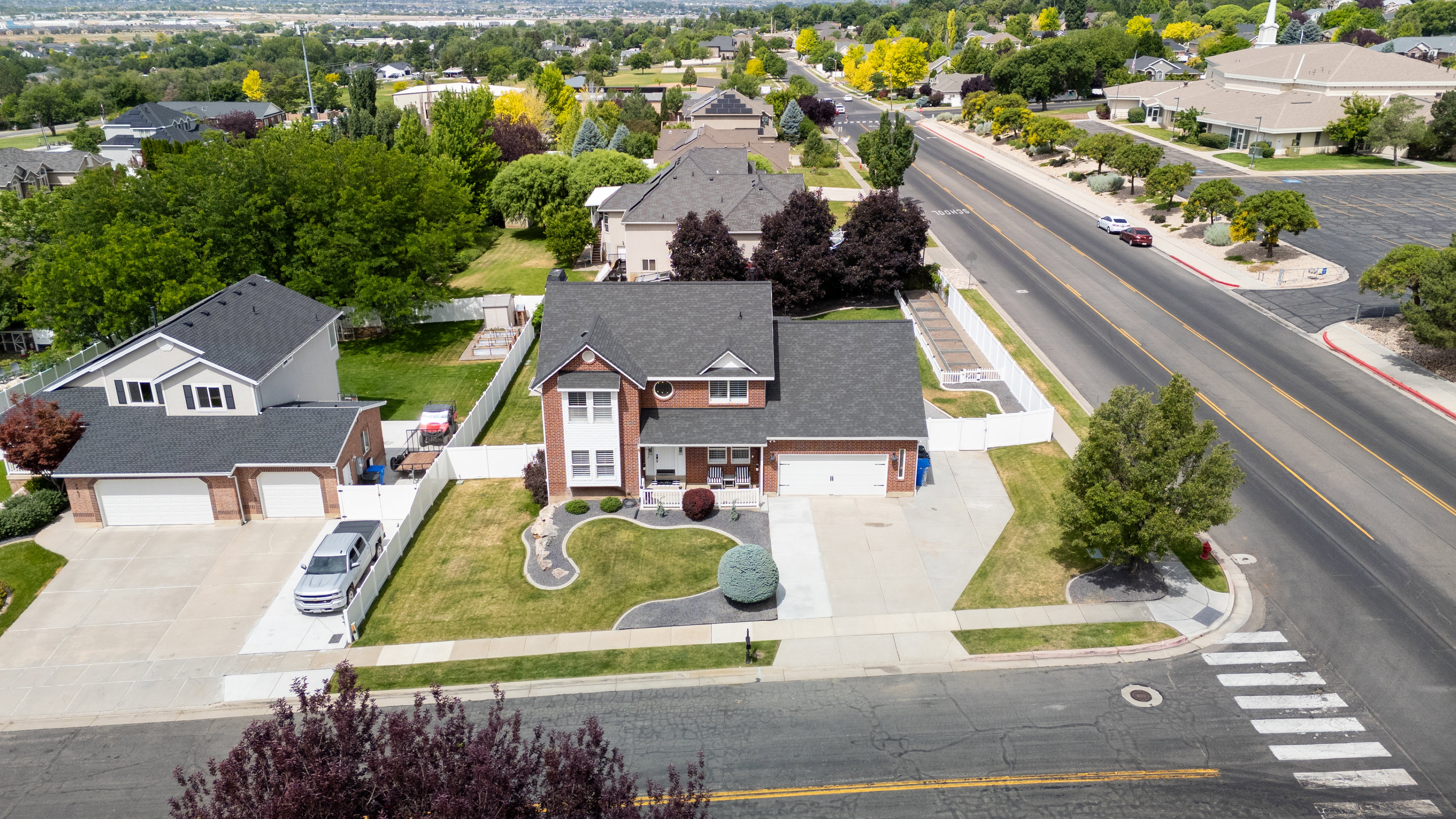 Aerial view of our brick exterior featuring white trim accents and a covered front porch