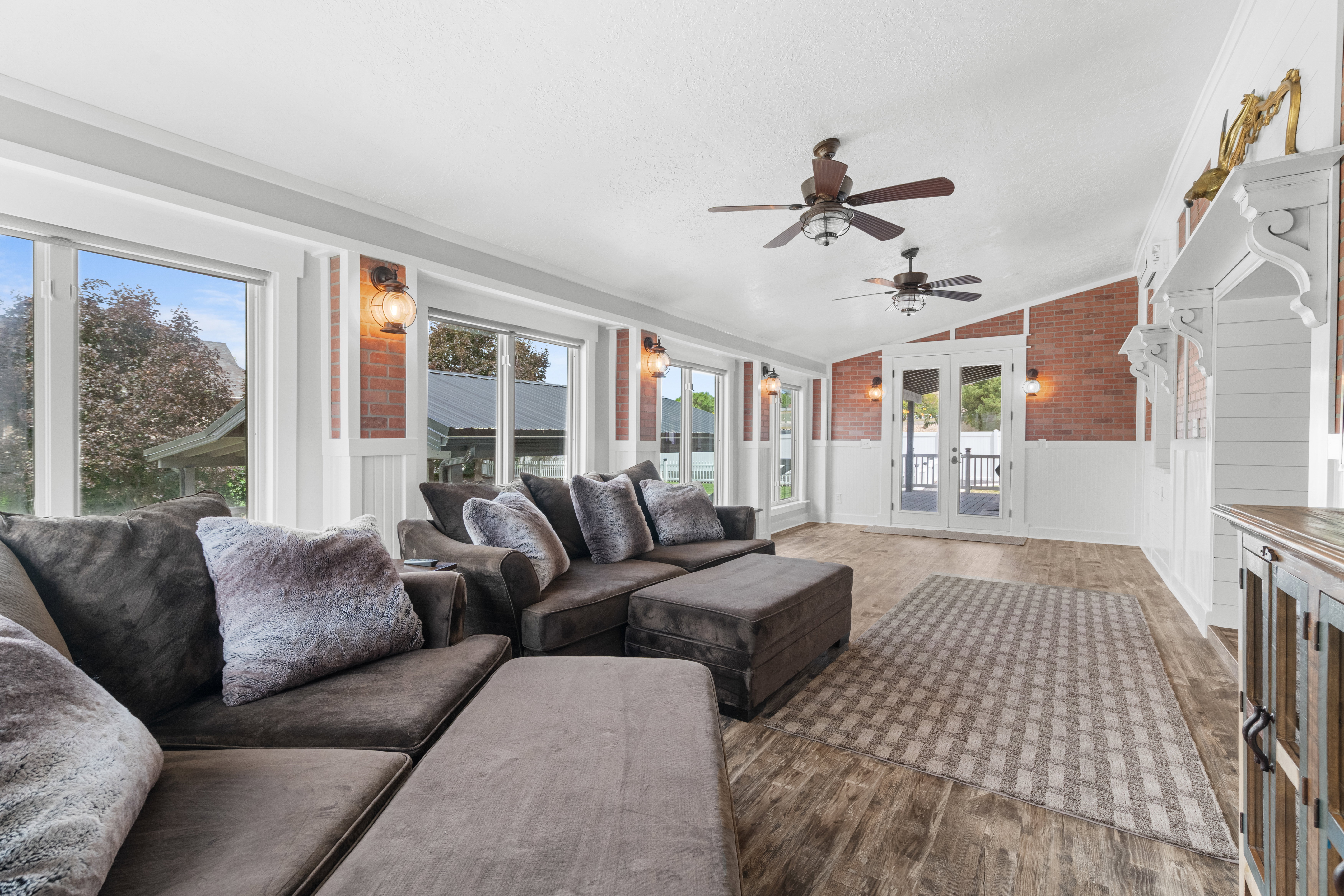 Great room addition with LVP flooring and multiple oversized windows