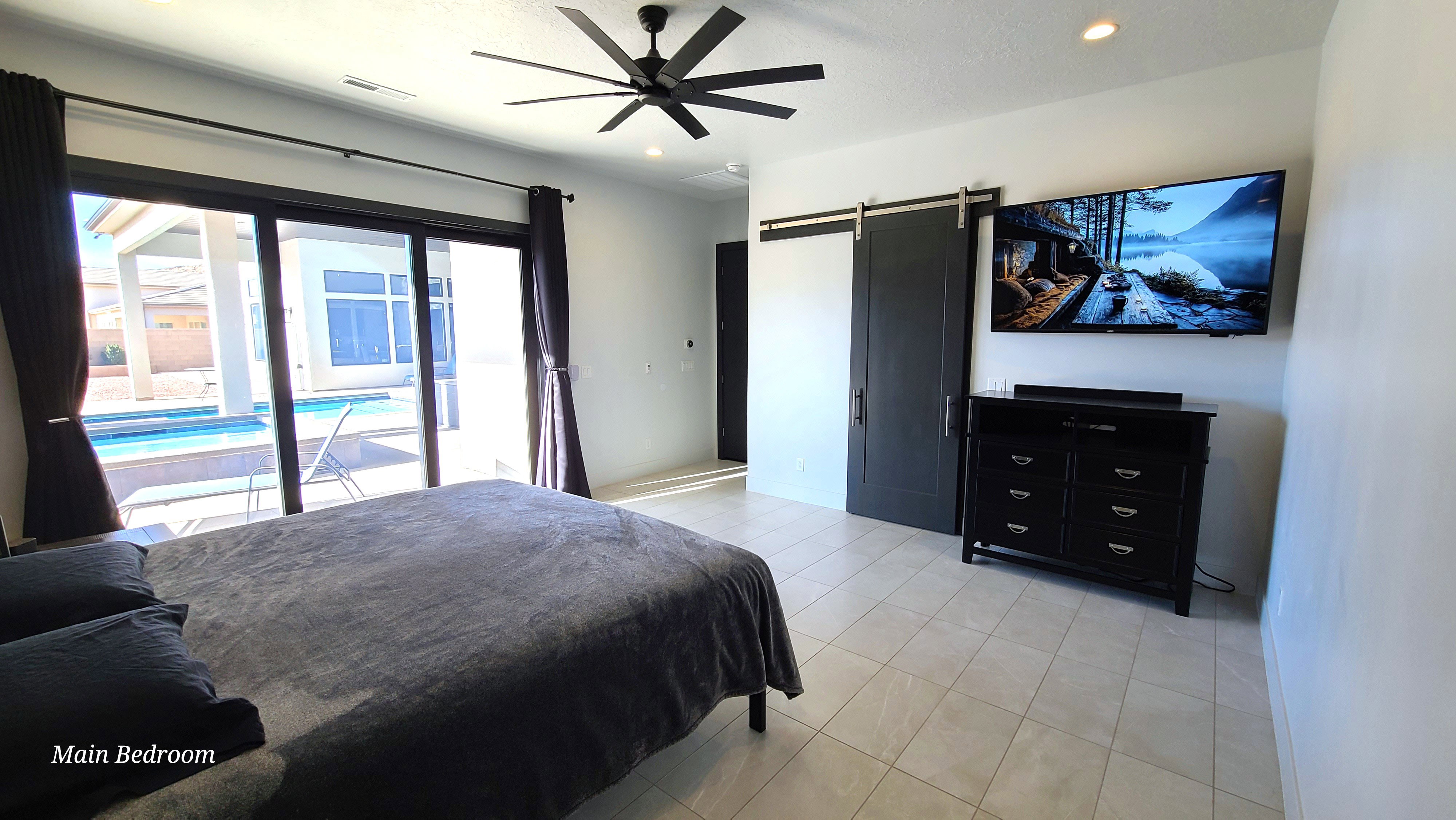 Interior space featuring large-format tile flooring and direct patio access through multi-panel sliding glass doors
