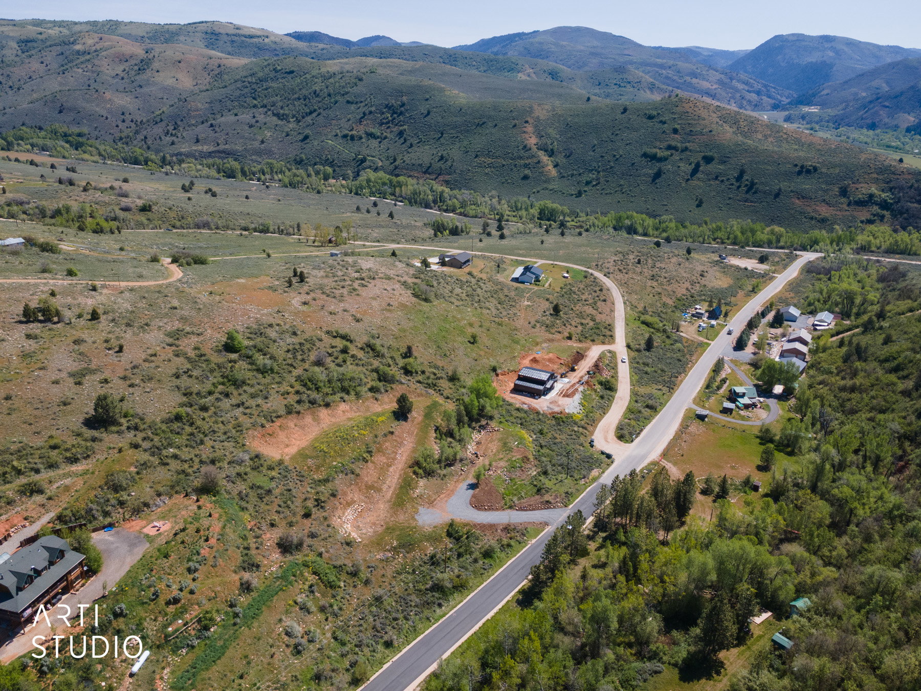 Expansive mountainous landscape featuring natural vegetation and distant valleys