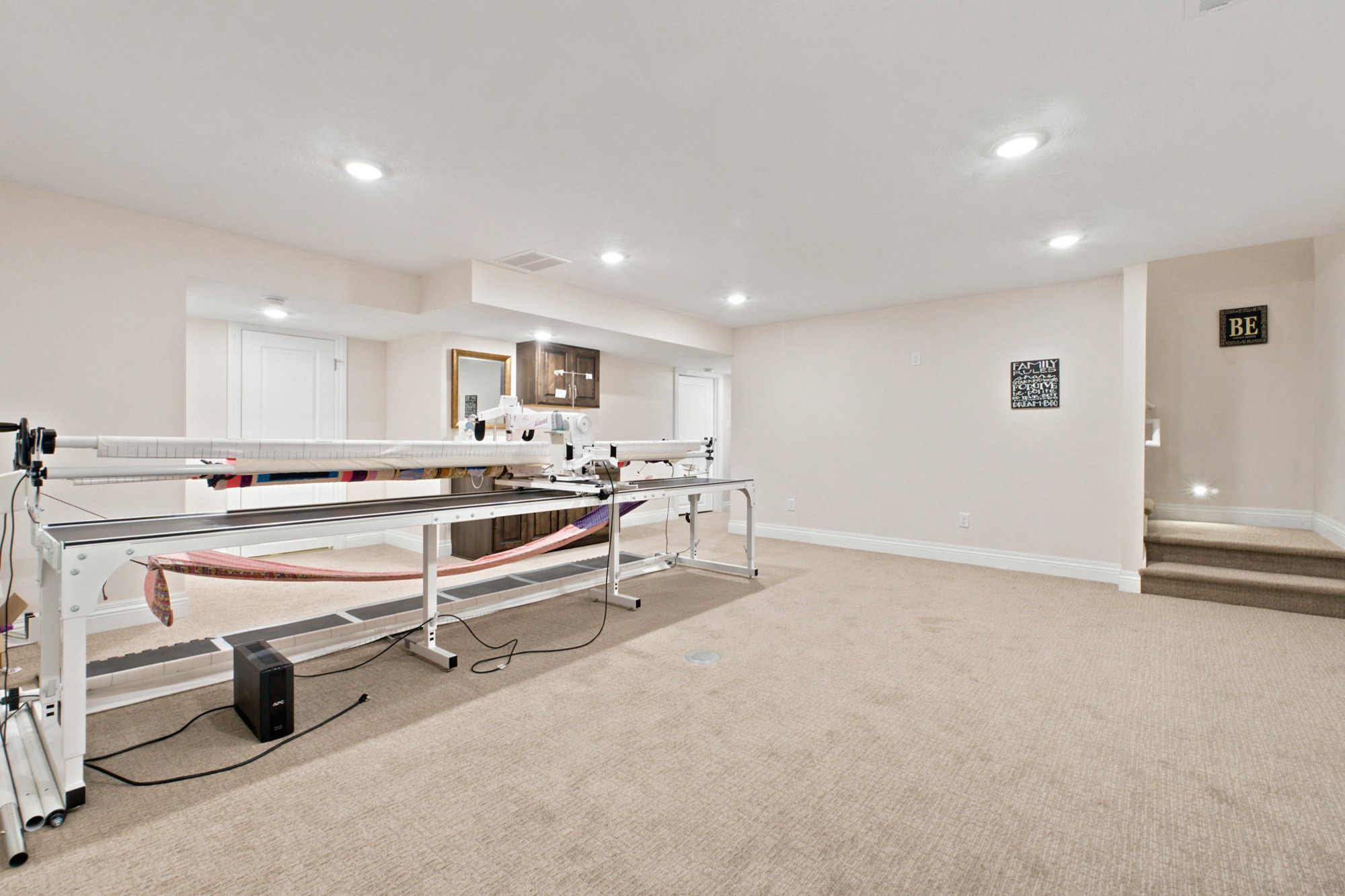 Carpeted family room with recessed lighting