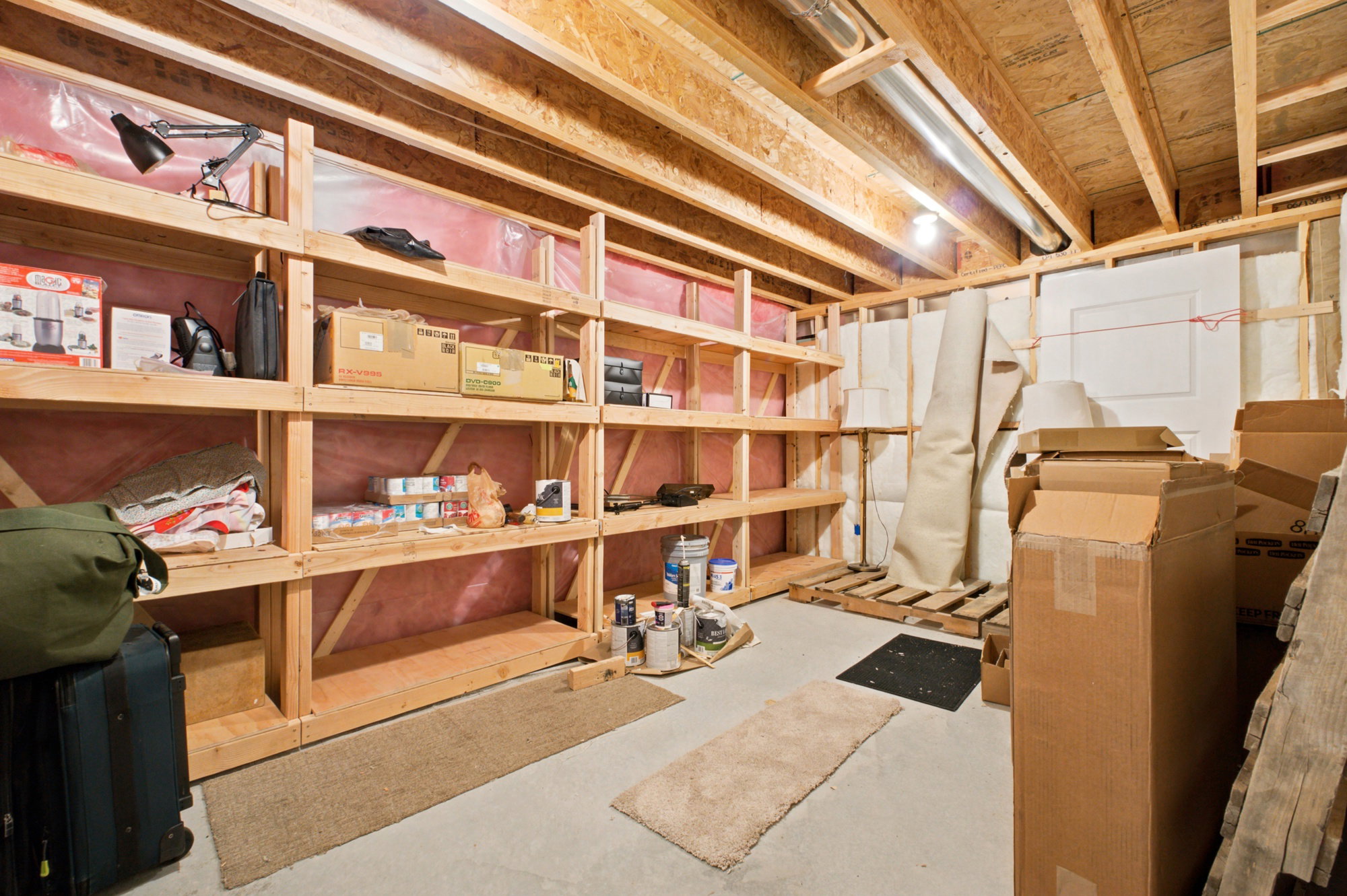 extensive built-in wooden shelving for storage