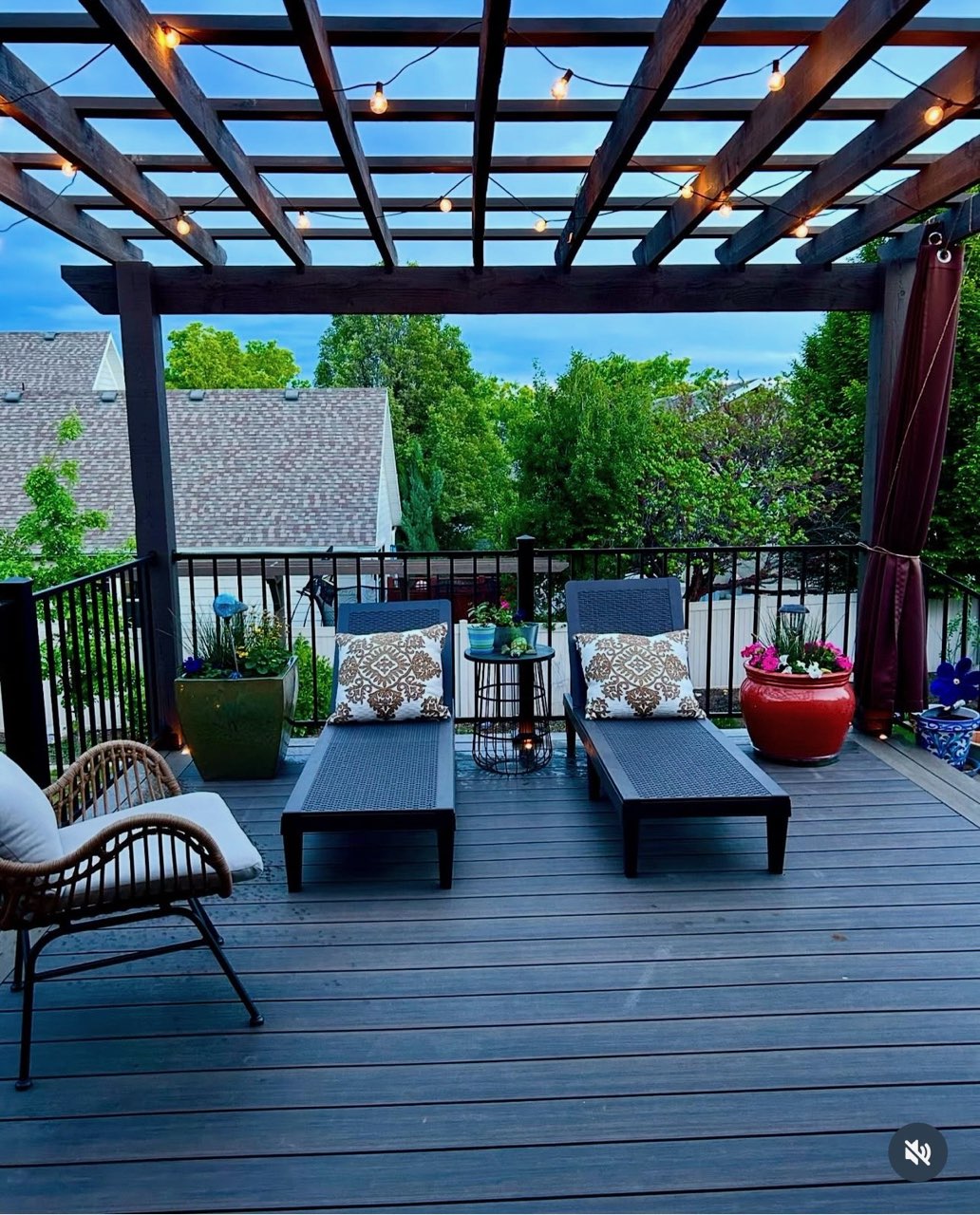 Wood pergola with integrated string lighting over a composite deck