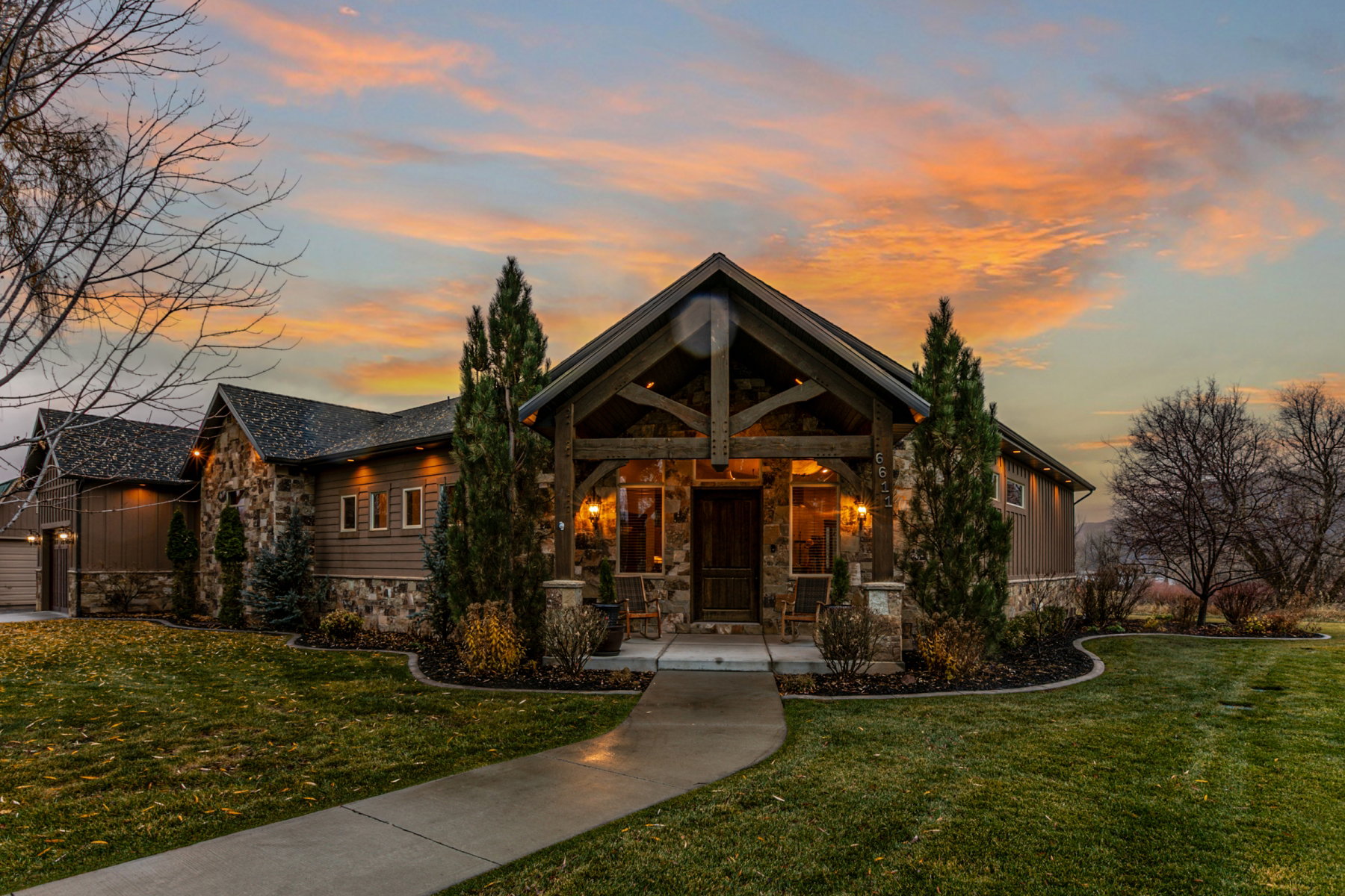 Craftsman-style exterior featuring stone accents and horizontal siding