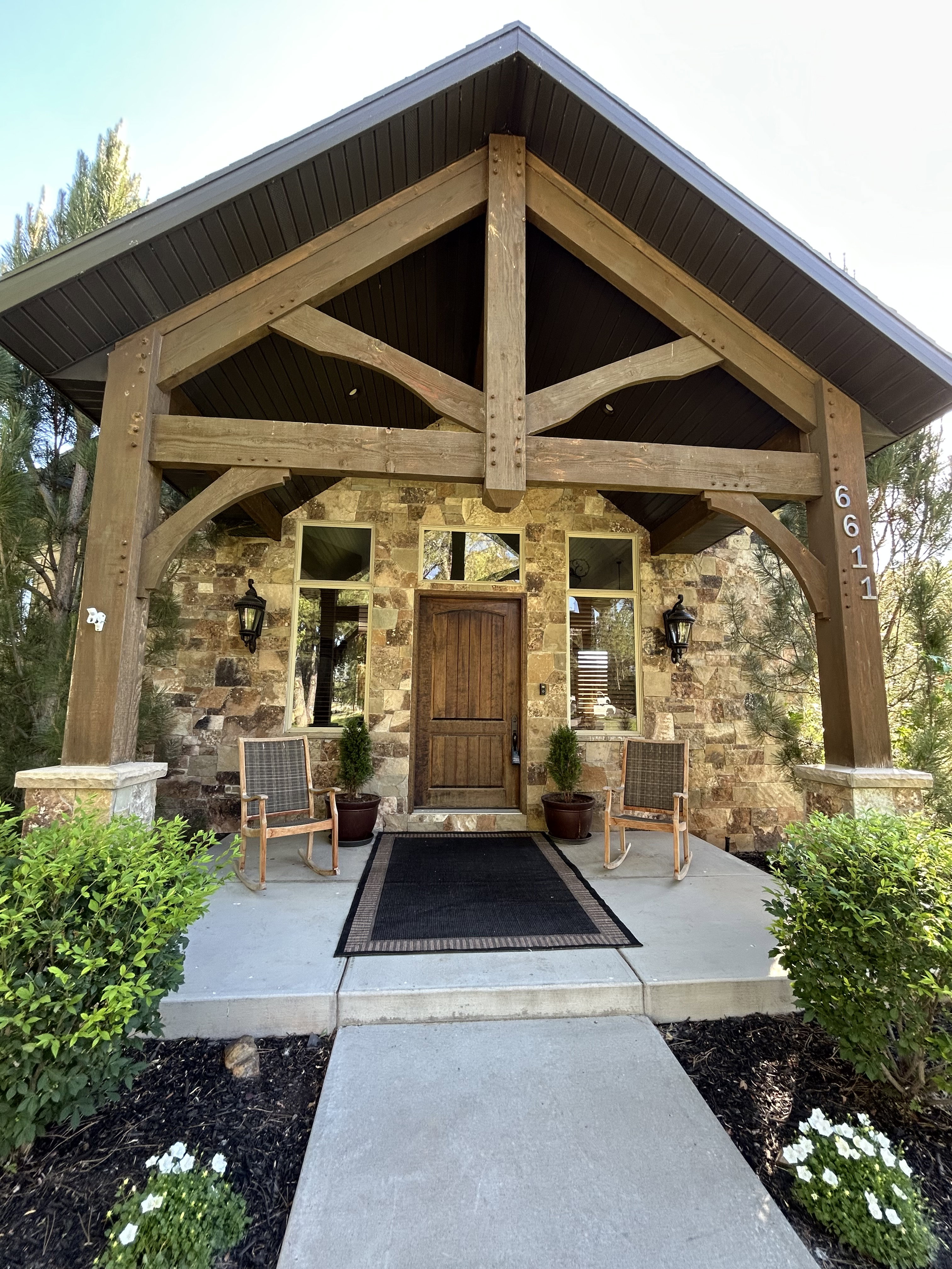 Stone facade with a prominent timber-frame entry