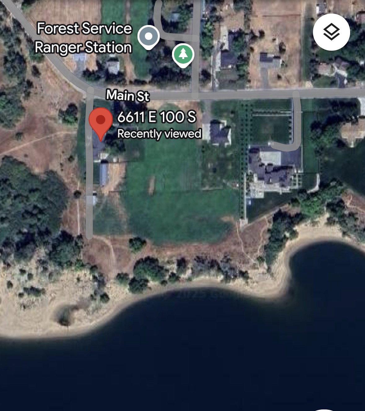 Geographic Information System (GIS) Map. Displaying the property's location relative to Main St and a Forest Service Ranger Station